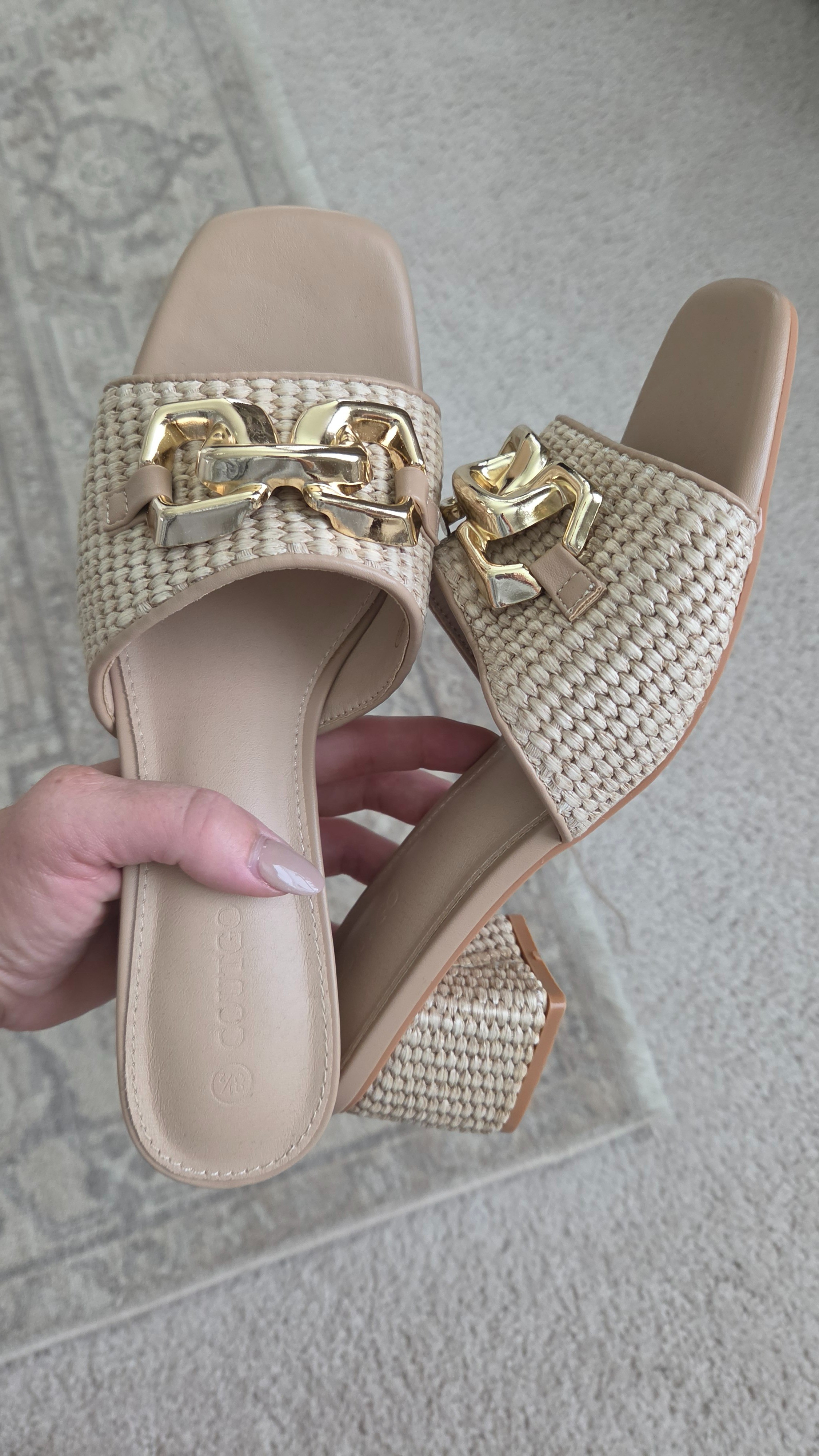 These woven block heel sandals from Coutgo feature a gorgeous gold chain detail that elevates any summer look. They are the perfect neutral shoe to dress up your favorite warm weather outfits.#Coutgo #SummerSandals #BlockHeels #SummerStyle

#LTKWorkwear #LTKTravel #LTKSeasonal