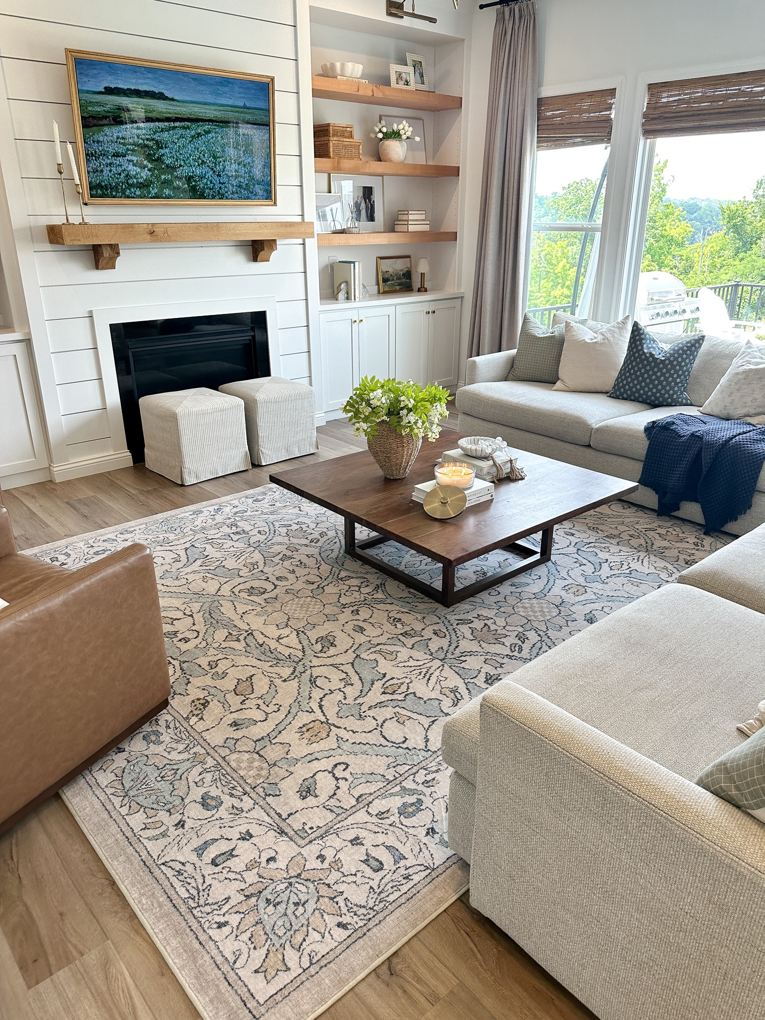 Living room design, ruggable rug, washable rug, bamboo blinds, pinch pleat curtains, crate and barrel lounge 2 couch, faux leather swivel chair, woven book, pillow covers 

#LTKHome