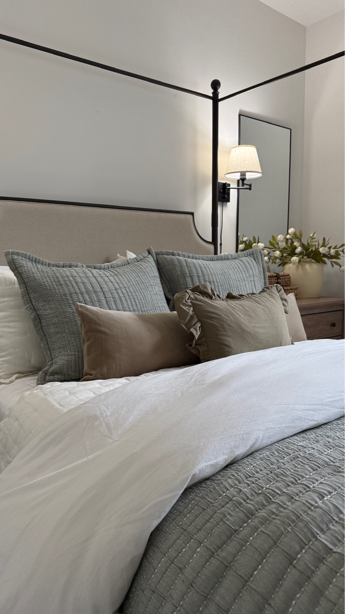 An up-close shot of our pretty guest room bed 🤎 I love the antique accent tones that these ruffle throw pillows and cozy layered bedding brought to this space. And having a sconce next to the bed is just so charming! ✨

#LTKHome