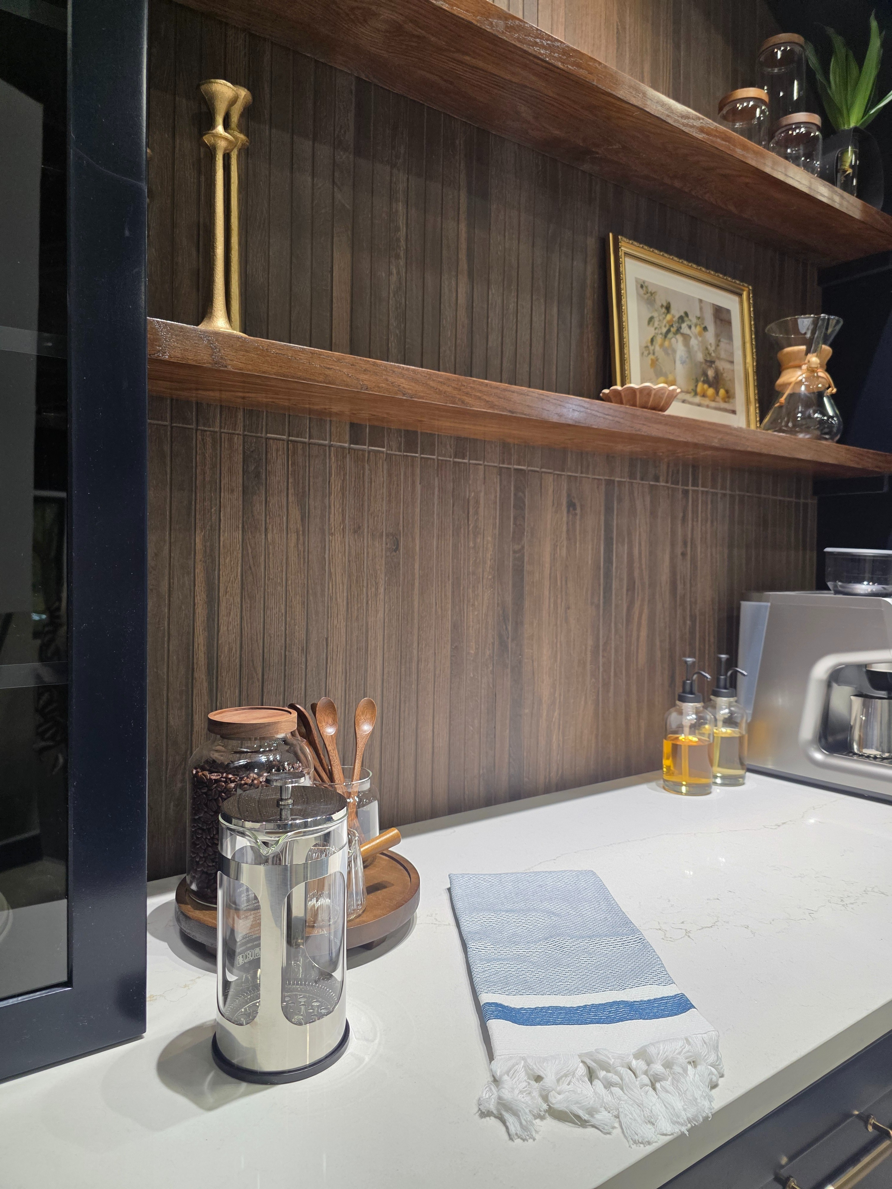 If you want that warm wood look in a hardworking space, this is it 🤎 A wood-look porcelain tile styled as a horizontal backsplash adds texture and depth while holding up to everyday use - perfect behind a coffee bar or open shelving. #coffeebar #lowes 

 #LTKHome