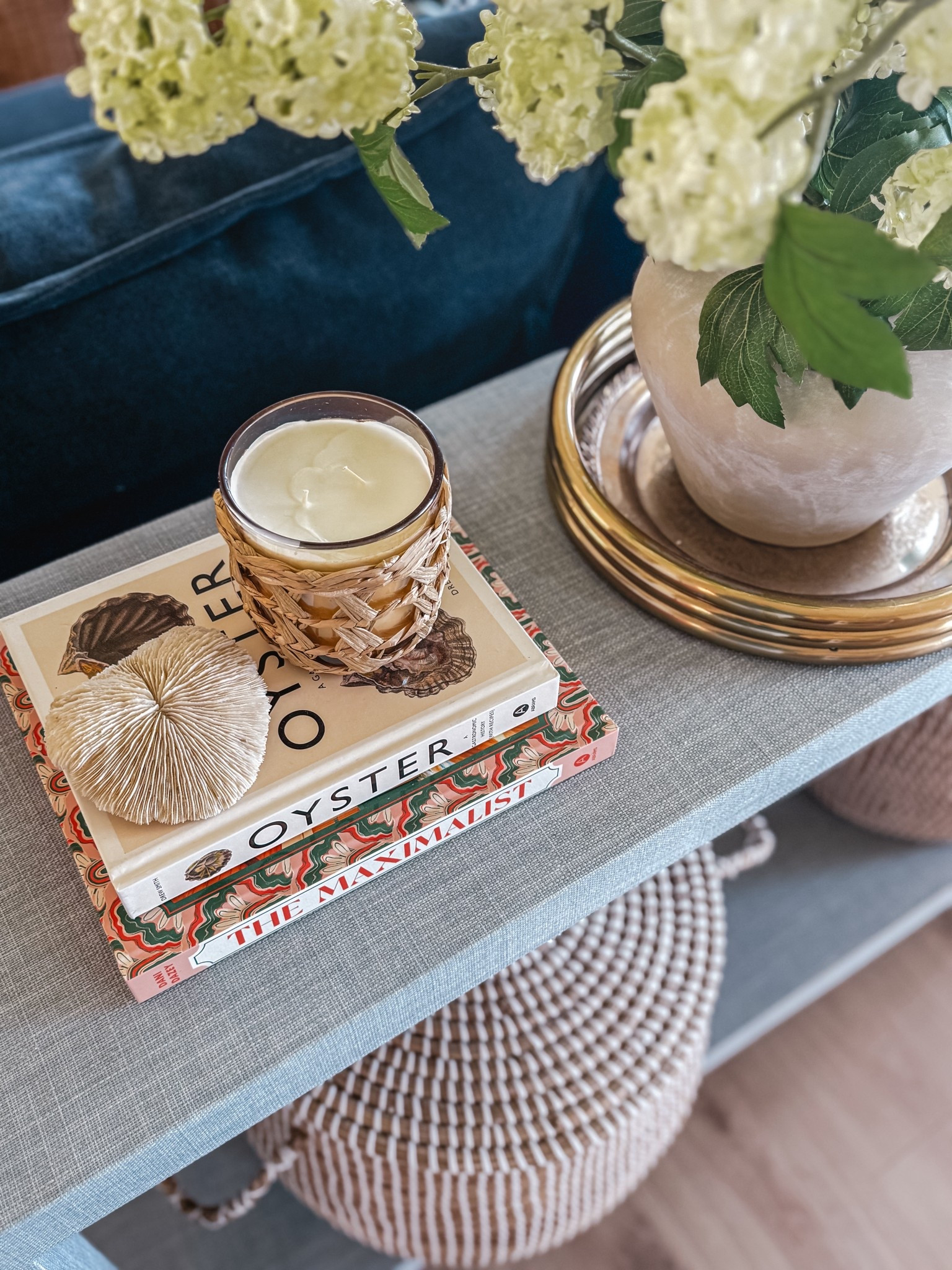 Table decor // coffee table books // candle // seashell // faux florals // faux hydrangeas// coastal home decor // seagrass console table 

#LTKSeasonal #LTKHome