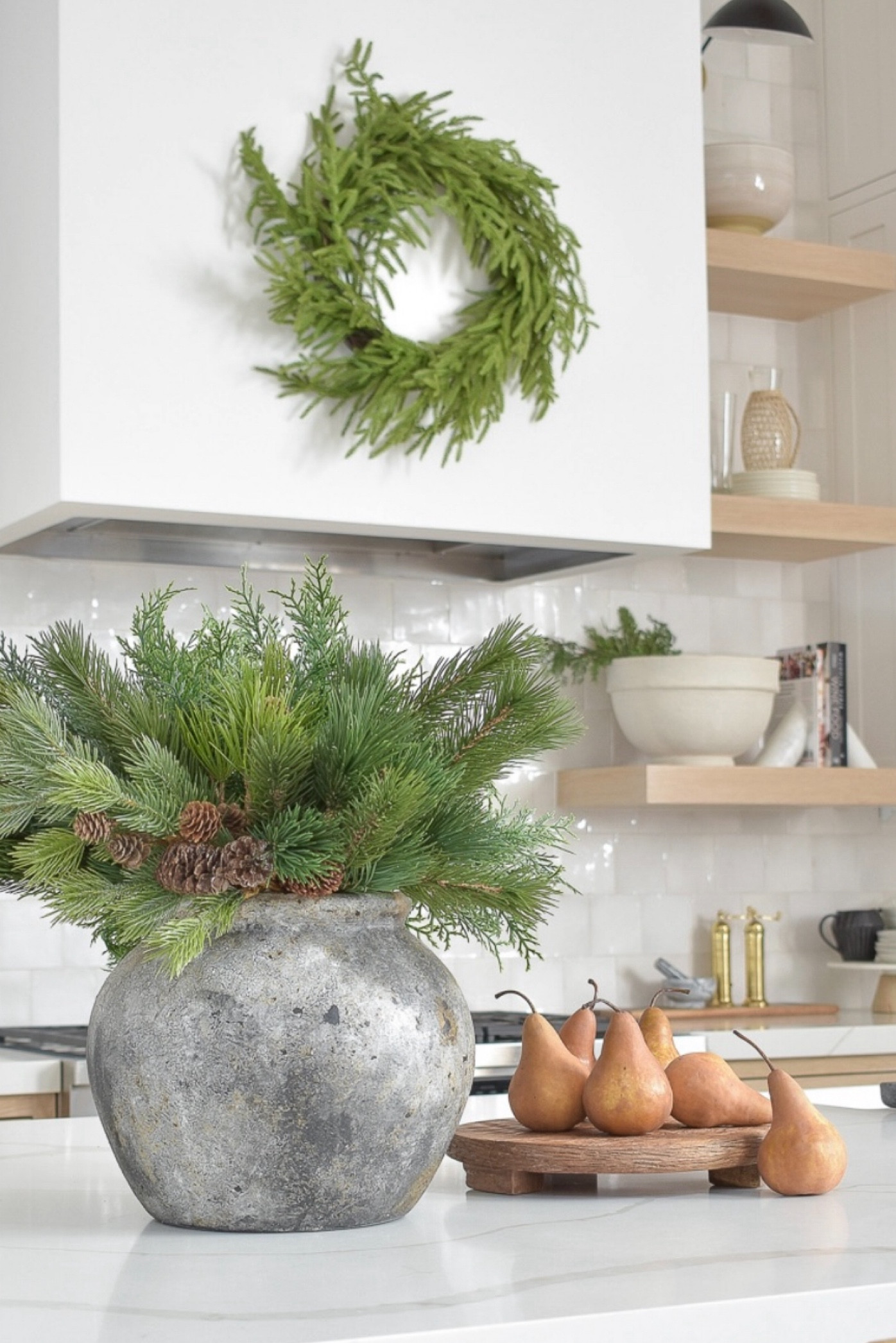 Love these mango wood pedestals I use for kitchen decor and they are 25% off right now, and available in 3 sizes!  Also love this awesome textured gray vase for this time of year and my Christmas stems!  My Norfolk pine wreath is also 20% off right now!!

#LTKHome #LTKHoliday #LTKSaleAlert