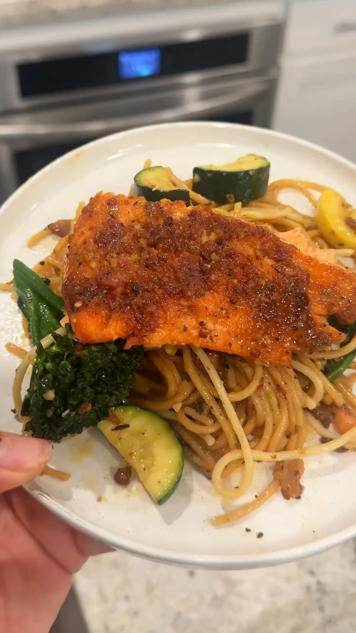 Brown-Crusted Trout with Spring Vegetable Spaghetti

Ingredients

trout fillets 
2 tablespoons olive oil
1 teaspoon kosher salt
1 teaspoon black pepper
½ teaspoon white pepper
½ teaspoon ground pink peppercorns (optional)
Pinch of brown sugar
Lemon wedges

Instructions

Preheat oven to 375°F.
Mix olive oil, salt, black pepper, white pepper, pink peppercorns, and brown sugar.
Rub the mixture all over the trout.
Place on a baking sheet.
Roast for about 12–15 minutes, until just cooked through.
Squeeze fresh lemon juice over the fish before serving.  

⸻

Vegetable Spaghetti

Vegetables

1 zucchini, sliced
1 yellow squash, sliced
1 bunch broccolini, chopped

Pasta

1 pound spaghetti

⸻

Bacon-Wine Sauce

Ingredients

4 slices bacon, chopped
1 onion, diced
3 cloves garlic, minced
1 cup white wine
1 cup chicken stock
2 tablespoons butter
Tbs brown sugar
Red pepper flakes
Italian herbs or Herbs de Provence
1 cup grated Pecorino Romano cheese
Fresh basil
Fresh cracked black pepper

Instructions

Make the Sauce

Cook bacon in a large skillet until it begins to render its fat.
Add onion, bell pepper, and celery.
Cook until softened.
Add garlic and sauté briefly.
Pour in white wine and chicken stock.
Simmer until reduced by about half.
Stir in:
Butter
Pinch of sugar
Red pepper flakes
Herbs
Remove from heat and set aside.  

Cook the Pasta

Bring a large pot of salted water to a boil.
Cook spaghetti according to package directions, then Add the Vegetables About 4 minutes after the pasta is finished

Cook just until bright and tender-crisp.  
Drain pasta and vegetables together.
Toss with the sauce.
Add a generous handful of Pecorino Romano cheese.
Season with black pepper.
Fold in fresh basil.
Serve alongside the trout.  

Serving Tip

Place the vegetable spaghetti in a large serving bowl, top with extra Pecorino Romano and basil, and serve the trout with lemon wedges on the side. The brown sugar and pepper crust on the fish balances the salty bacon, wine sauce, and fresh spring vegetables beautifully.