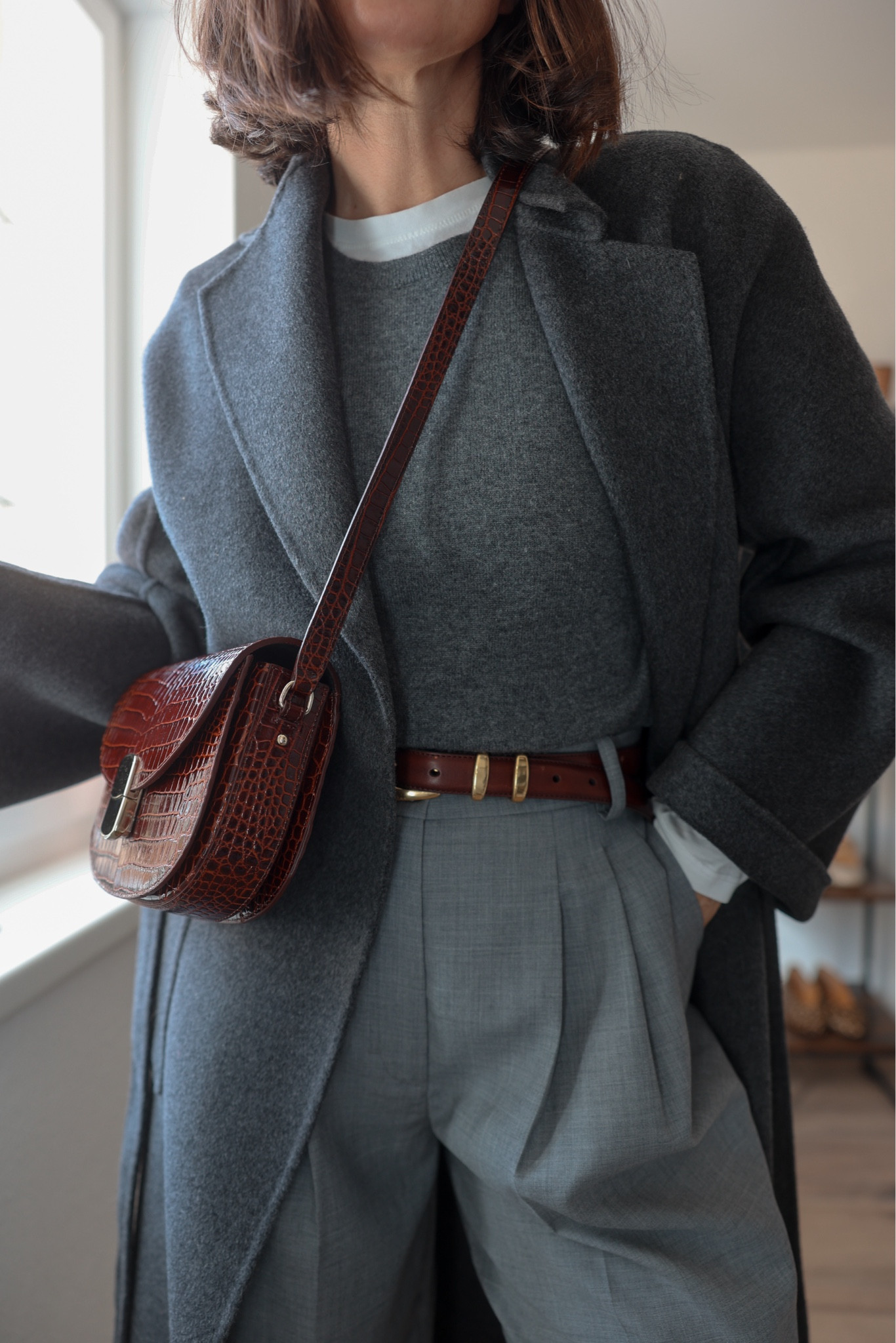 Grey with brown-burgundy. 

Grey Wool barrel pants: COS
Burgundy-brown bag: Sézane
Belt: Aritzia
Grey sweater: Everlane
White longsleeve tee: The classic T-Shirt Company
Grey Merino Wool/Cashmere coat: The Curated (it’s called the classic coat)

Spring outfit, monochrome look, office style, minimalist fashion



#LTKstyletip #LTKeurope #LTKworkwear