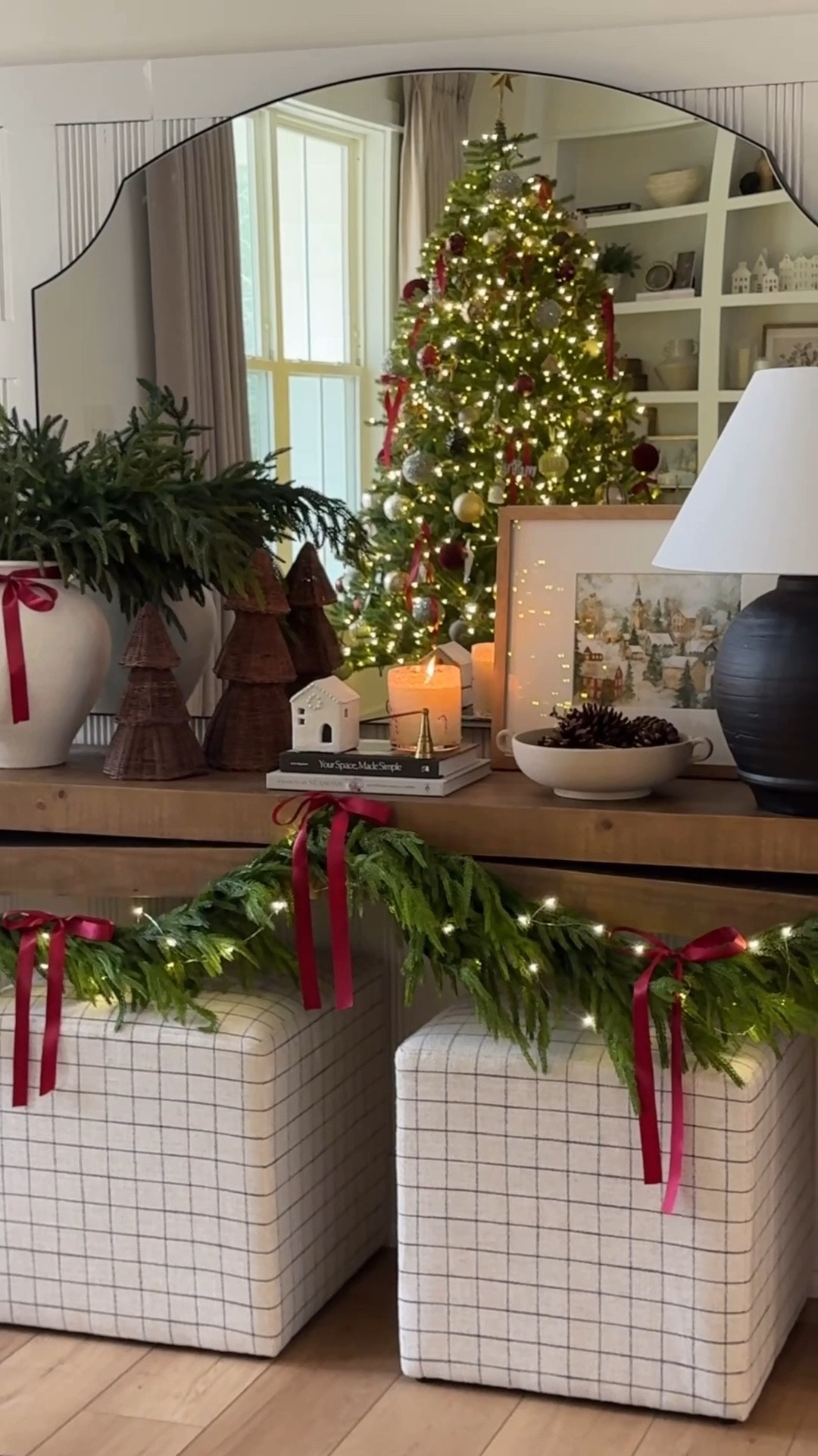 My entryway table featuring a little sneak peak of my Christmas tree. 🌲 

This is by far one of my favorite views of Christmas in my home. I love the bows on the garland. I love seeing the built ins and the tree in the background. I actually ended up adding warm slow twinkle lights (a lot of the twinkle lights are a little fast for my liking) and I don’t think I’d ever go without them. I love the twinkle! 

Console table
Entryway table 

#LTKHome #LTKSaleAlert #LTKHoliday