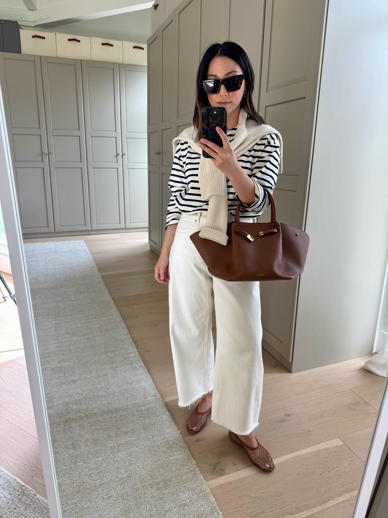 Cannot stop wearing this tee. It’s so elevated just by itself. Runs roomy. But I love this fit!
The perfect barrels- so comfy. 


Tuckernuck tee xs
Everlane curve jeans 26 - cut hems and sized up 
Staud flats 35
Everlane cashmere sweater xs - color is old
DeMellier midi bag
Celine sunglasses 
Electric Picks earrings
Dorsey James necklace 16"

#LTKootd #LTKOver40 #LTKPetite