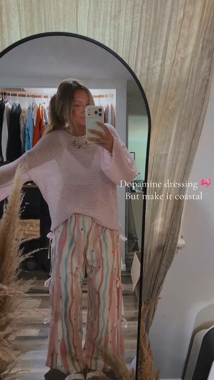 Okayyyy but this pink coastal girly dopamine dressing era might be healing me a little 🤍🎀🌊

As someone who naturally lives in neutrals, stepping into softer, happier colors has felt weirdly therapeutic lately. Like embracing a more feminine, carefree version of myself instead of always hiding in beige 😂

The lightweight knit sweater + flowy bow detail pants combo is SO comfy while still feeling cute enough to wear out and about for spring/summer.

And honestly? The effortless claw clip, naturally dried hair, cozy coastal vibe is exactly the energy I’m trying to embody lately 🫶🏼

The nurse at the doctor’s office literally stopped me to tell me how cute this outfit was and I was like okayyyy maybe we’re onto something 😂

Everything is linked on my LTK ✨ and shoutout to @shein  for feeding my coastal girly obsession lately.

#dopaminedressing #coastalgirl #pinkgirly #sheinfinds #coastalboho

#LTKgrwm #LTKootd