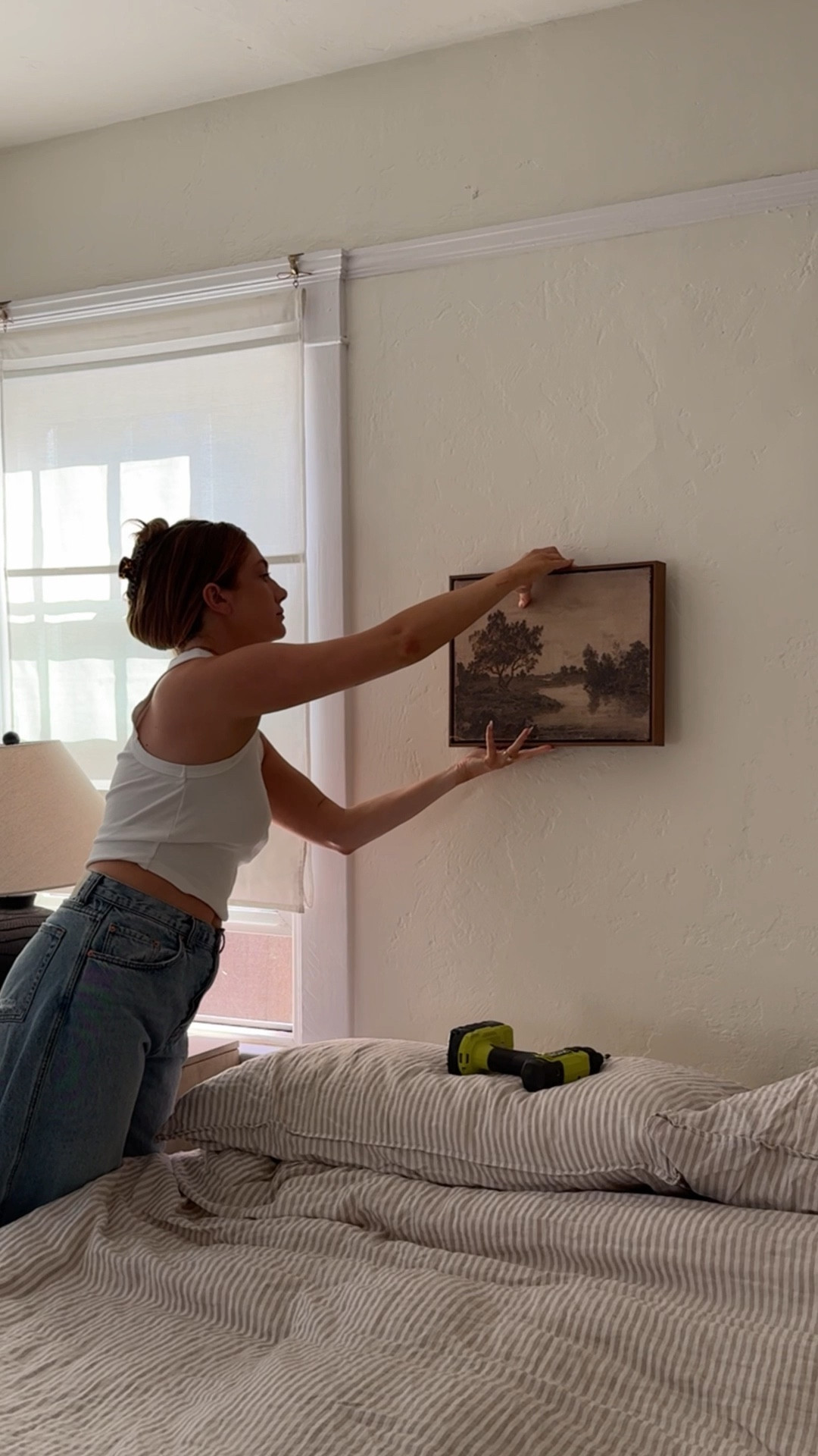 Hanging a cute little piece of art I got from Target! 