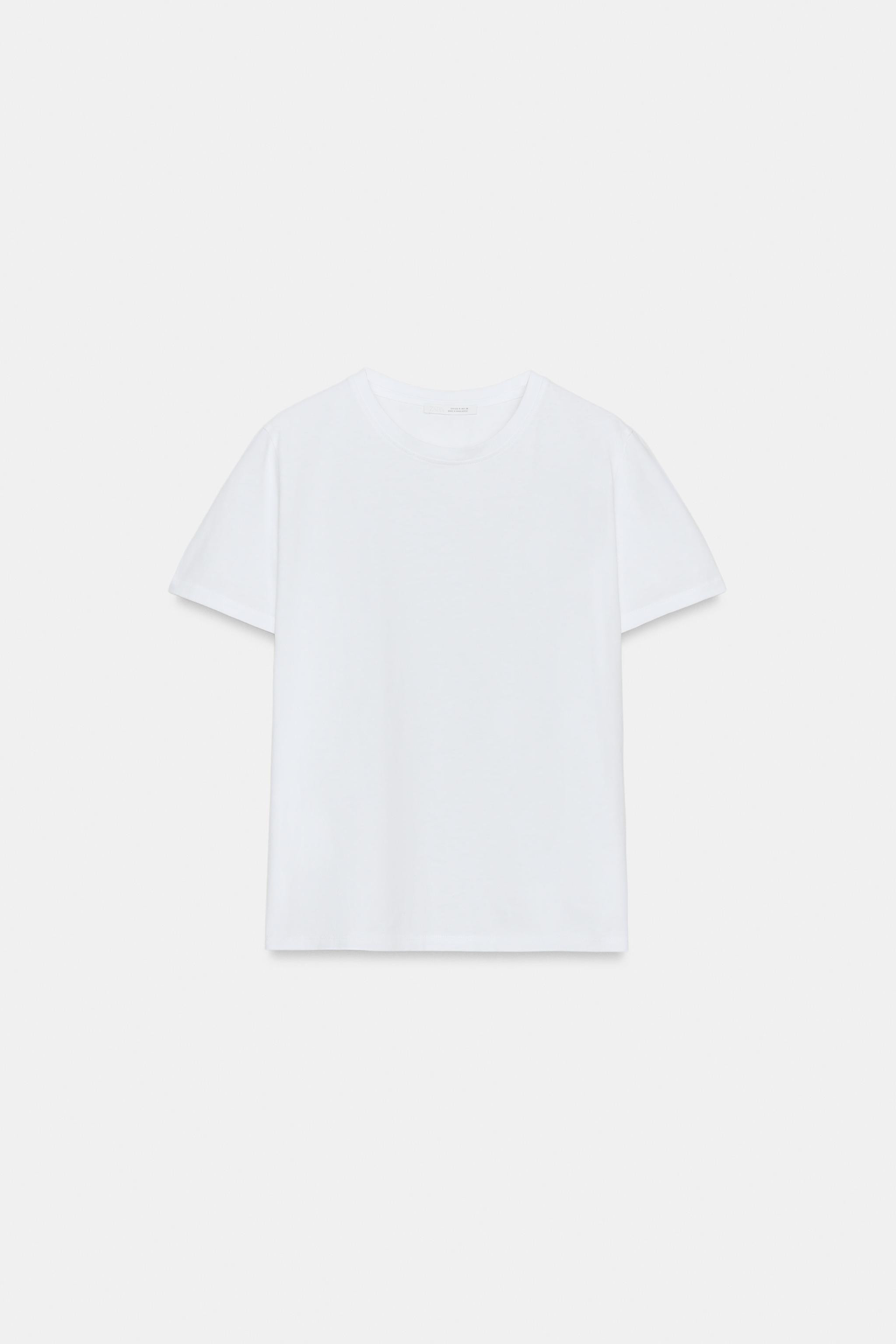 Round neck top with puff sleeves and shoulder pleats. Flared hem. Front button closure. | Zara US