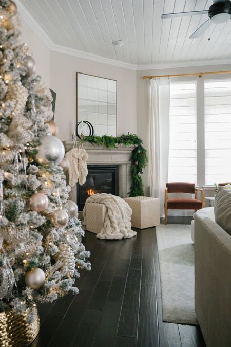 Christmas mantel, Christmas garland, woven leather ottoman pouf, faux fur blanket, living room, taper candle holder, home decor

#LTKhome #LTKSeasonal #LTKHoliday