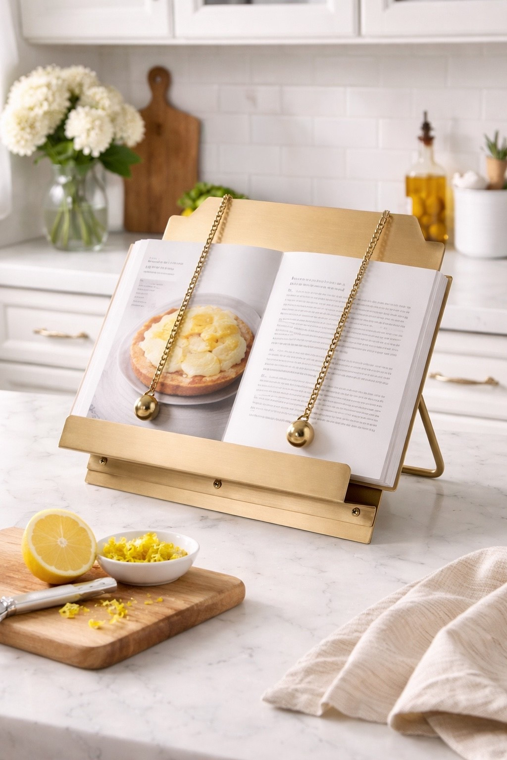 One of my most asked about kitchen find.. this brass cookbook stand ✨

One of those small finds that just makes your kitchen feel more put together 🤌
Functional and pretty… which we love.



#kitchenfinds #amazonhome #ltkhome #kitchendecor #homeinspo

#LTKSaleAlert #LTKHome