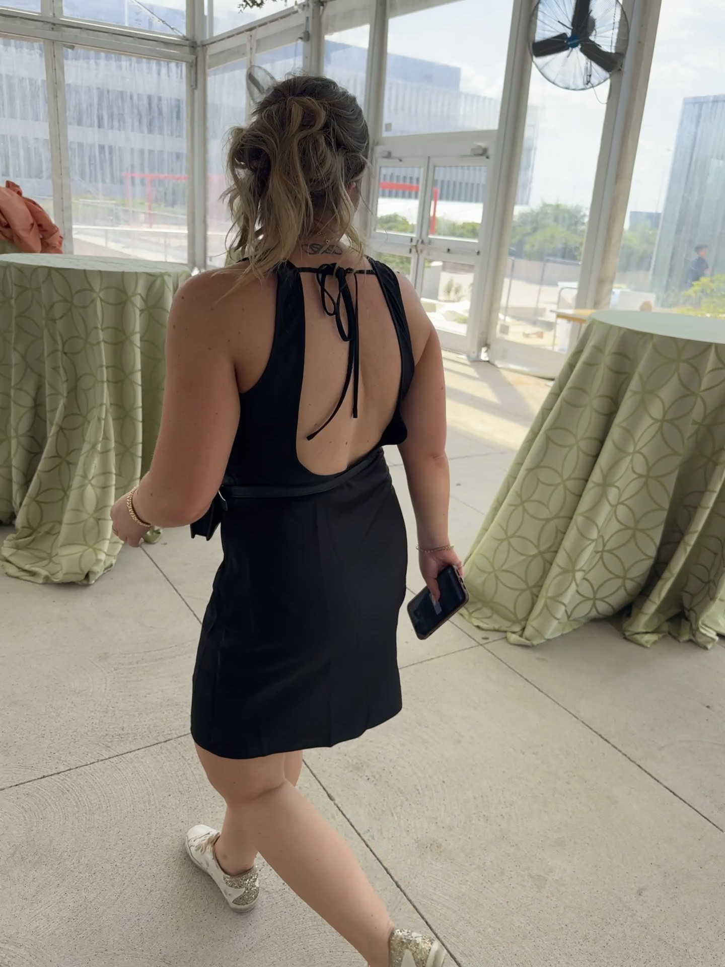 Wedding day mode: activated! 💍✨ Balancing outdoor tasks and on-the-go planning in my staple LBD (little black dress) and comfy sneakers. Perfect for staying polished while making the magic happen. #WeddingDayStyle #TheWeddingPlannerWardrobe