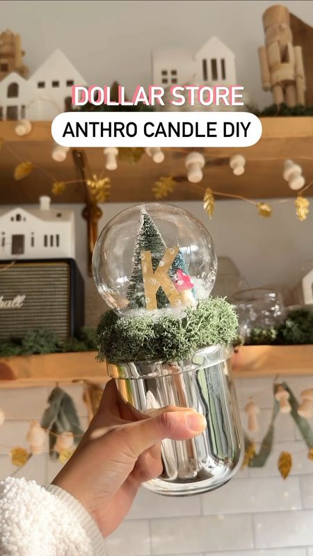 Make this Anthro candle  for $15 instead of buying it for $44! You can get most of the supplies at  the dollar store but I’ll link alternatives in my LTK. Link in bio!

I was surprised I could source the snow globe, moss, paint, monogram letters, glitter, and mini Christmas  trees all at Dollarama. And our IG fam told me that the Dollar Tree has the wooden mushrooms! The only thing not from the dollar store was the candle and the Rub n’ Buff but the dollar store has gold paint! 

Technically you can even buy the candle at the dollar store as long as it has a lid. The candle was the most expensive part of this DIY! 

This is the perfect budget friendly gift idea that’s also personalized and so dang adorable! I think it looks even cuter than the Anthropologie snow globe candle! 🤫 

#budgetfriendlygifts #giftideas #diygifts #budgetfriendly #christmasgifts presents, affordable gifts, affordable presents, diy presents, Anthropologie look a like, craft with me, crafters gonna craft

#LTKHoliday #LTKGiftGuide #LTKVideo