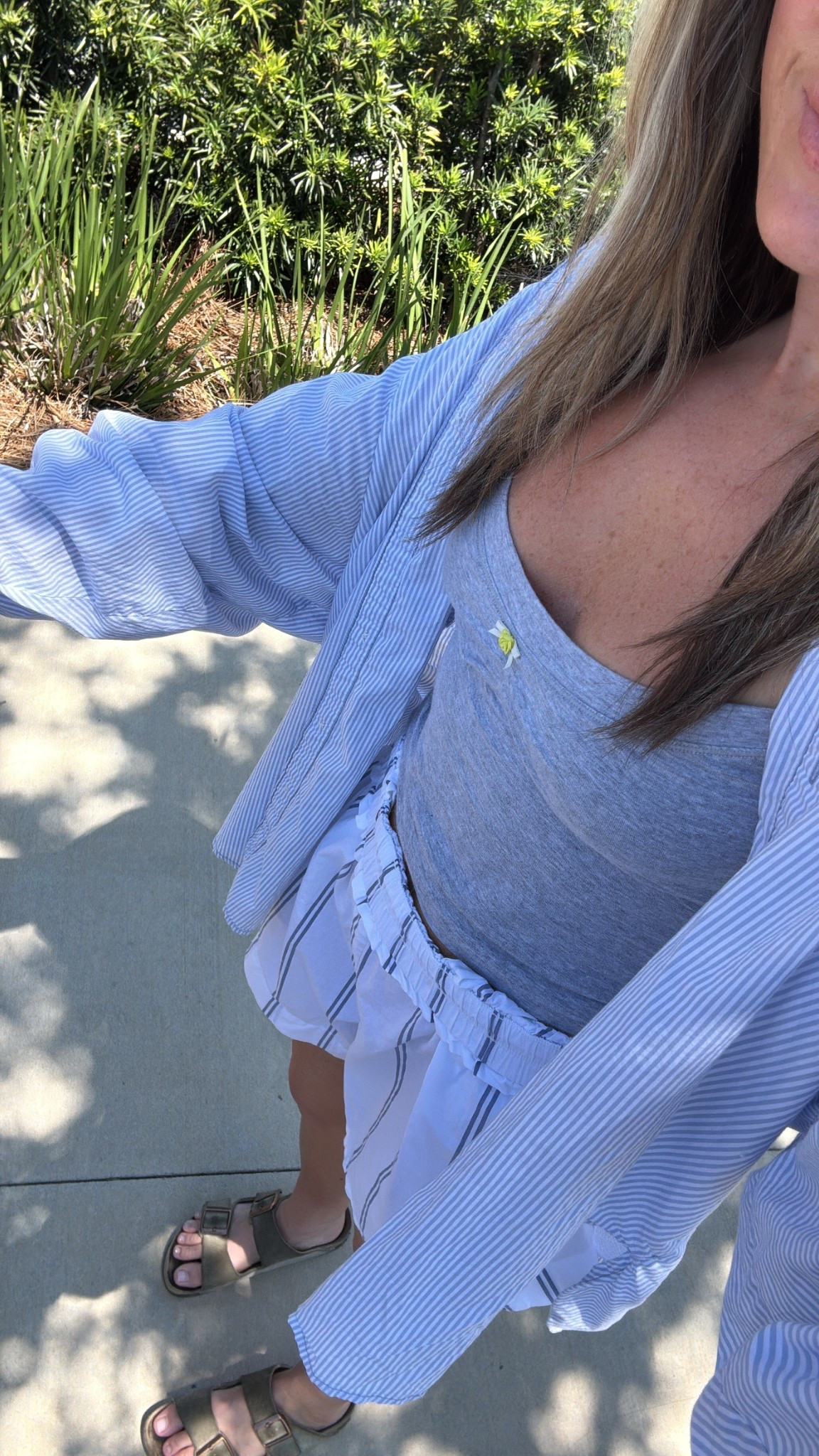 I am wearing a small in the shorts and button up, an extra small in the tank! 