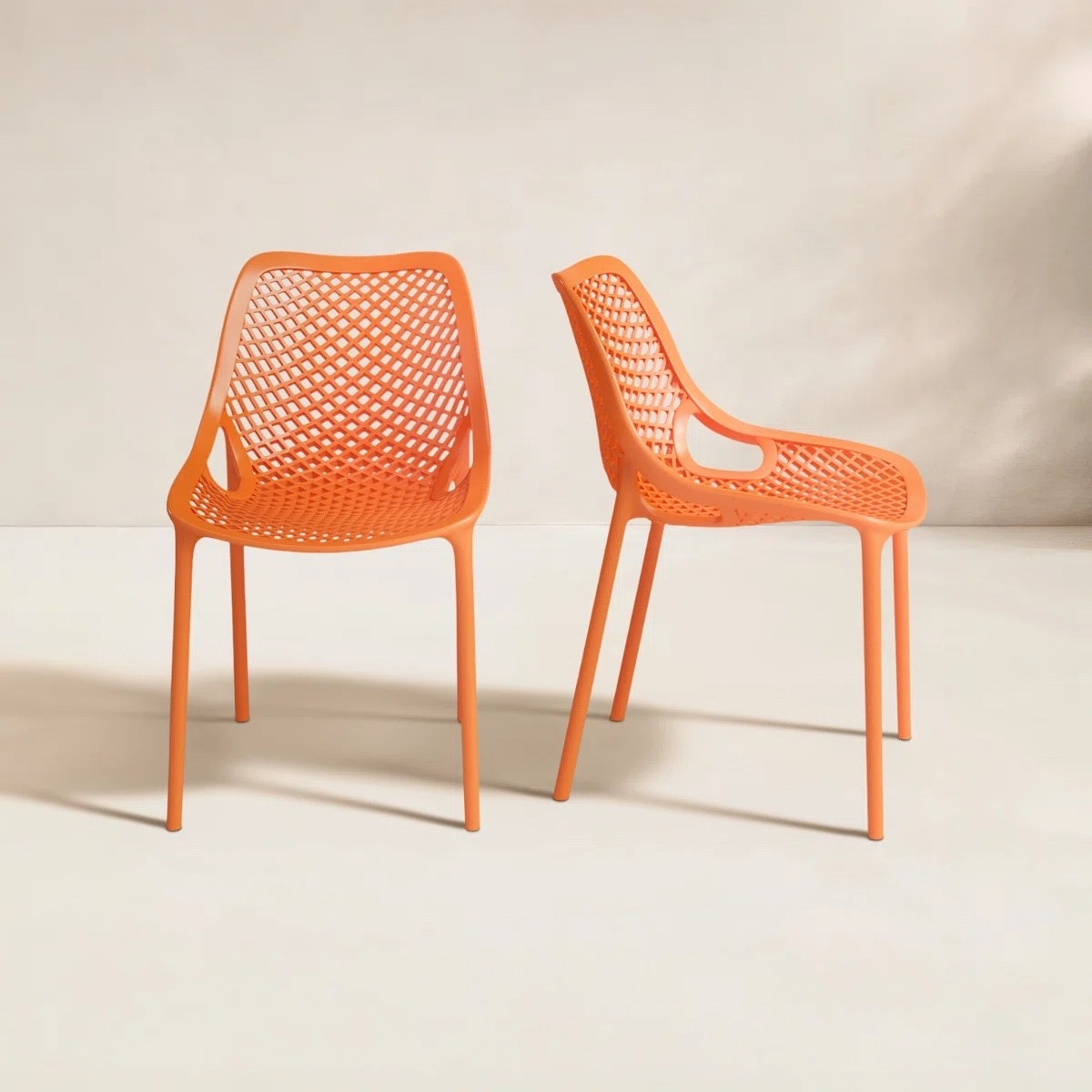 These Farrah all-weather outdoor dining chairs by AllModern are such a fun way to add a pop of color to your patio. The bright orange tone and modern woven design feel playful but still sleek, and they’re perfect for stacking and saving space. Style them around a dining table or mix into your outdoor setup for a bold, modern vibe. 