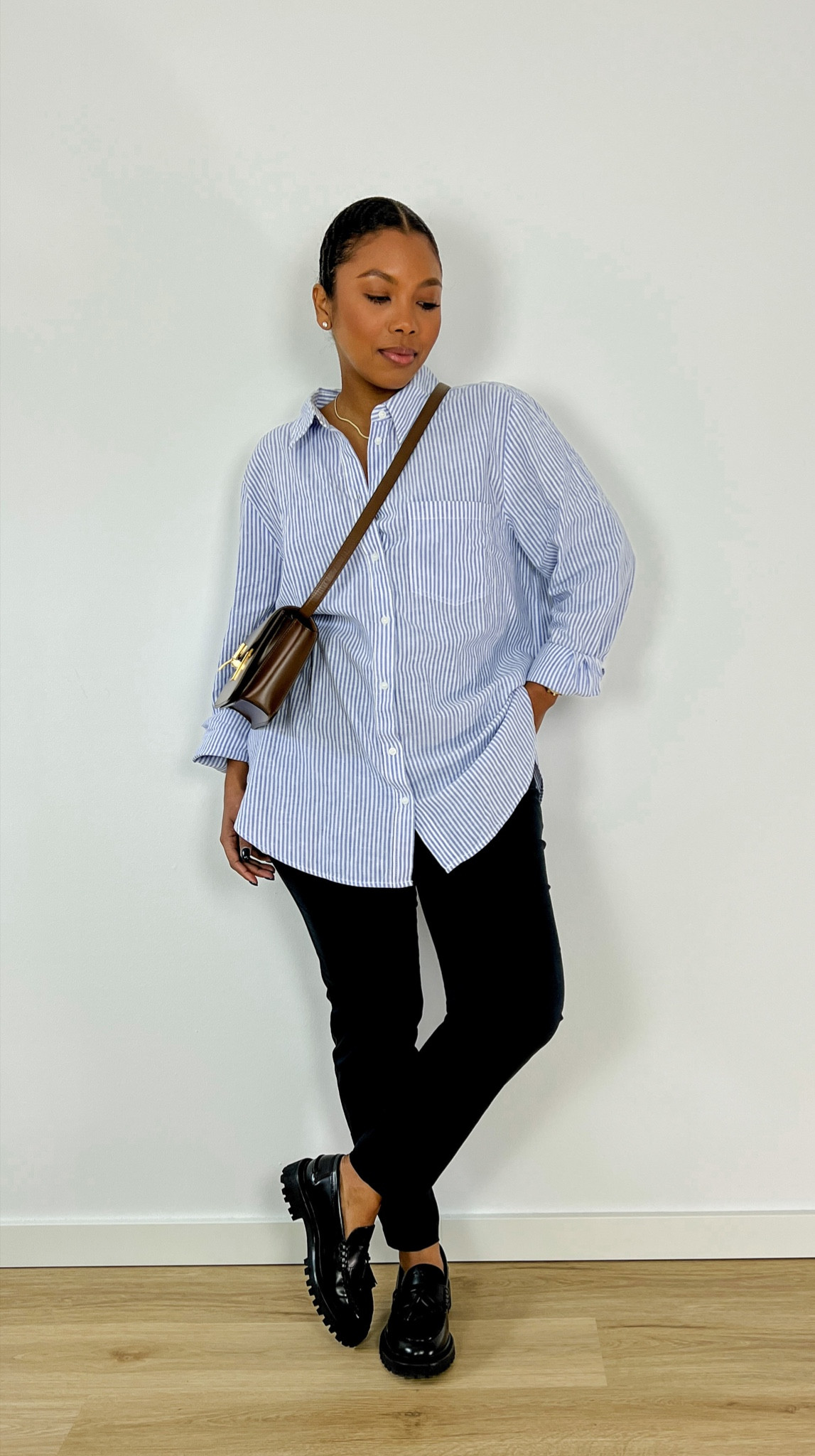 Minimal Spring Outfit inspiration. H&M, Oxford Shirt, Massimo Dutti, leather crossbody bag, Blue shirt, work outfit, black trousers, loafers, effortlessly chic, modest fashion, curvy fashion, capsule wardrobe.

#LTKfit #LTKcurves #LTKSeasonal