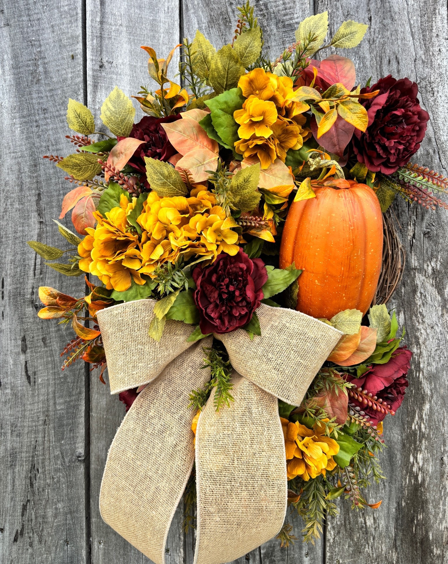 🍂 Fall is calling… and this beauty is officially NOW AVAILABLE! 🧡

Warm golden florals, rich burgundy blooms, a rustic burlap bow, and the sweetest pumpkin make this wreath the perfect way to welcome the season.

#LTKU #LTKSeasonal #LTKHome
