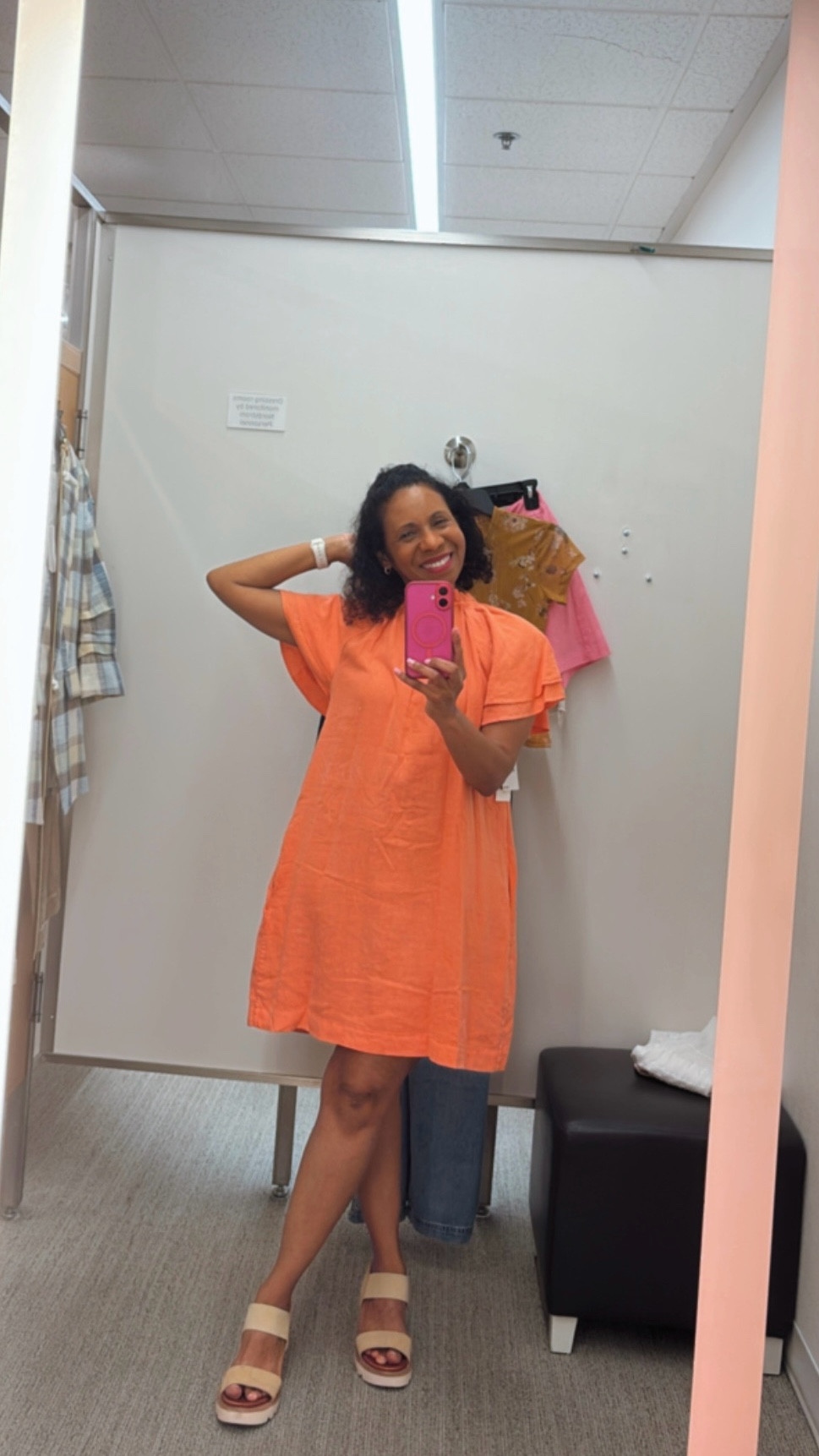 Tried on Treasure & Bond’s Flutter Sleeve Linen Blend Shift Minidress in coral reef. I love the bold color for transitioning from summer to fall, plus the ruffled neckline and tie detail. Funny story—I first tried it on backwards 🤦🏽‍♀️ and honestly loved how stylish it looked that way, too! For reference, it’s called a mini dress but hits just above my knees. #modestfashion #modeststyle 
#ModestSummerFashion #ModestSummerStyle 

#LTKTravel #LTKStyleTip #LTKSeasonal