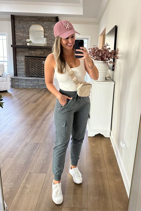 Casual Amazon outfit! Sports mom weekend outfit. 

Casual square neck tank top is double lined & super soft, paired with these Lulu look for less cargo joggers from Amazon. Love these white sneakers too (use code Dorothy20 for 20% off anything at Pink Lily). Belt bag & gold hoops are also Amazon finds! 

The perfect Weekend mom outfit, travel outfit, sports mom outfit, tank top, cargo joggers, Lululemon lookalike, belt bag, New York Yankees hat, summer style, mom fashion 

#LTKSeasonal #LTKstyletip #LTKActive