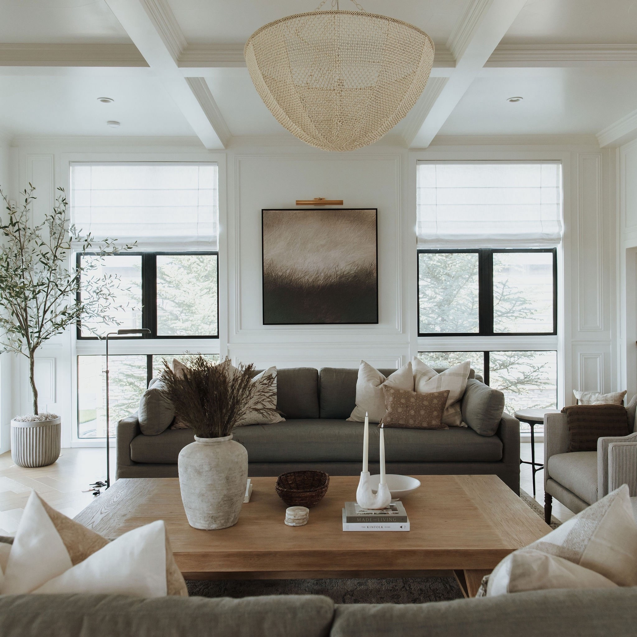 We love how this rich and cozy living room turned out. It’s so elegant and the chandelier really elevates the space. The gray sofa against the white walls provides perfect contrast. One of our favorite living room designs. 

#LTKStyleTip #LTKSaleAlert #LTKHome