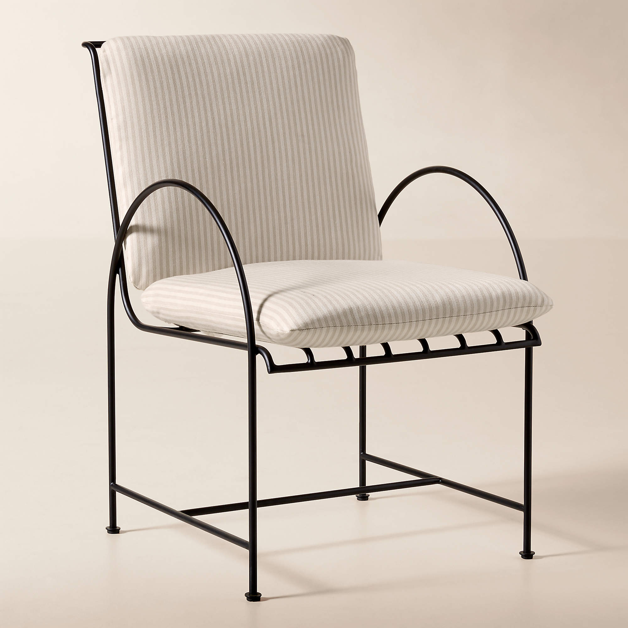Costa Black Metal Outdoor Dining Armchair with Natural And White Striped Sunbrella Cushion | CB2 | CB2