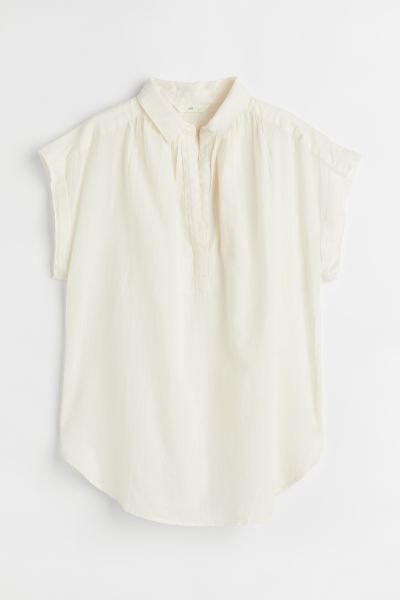 Short-sleeved blouse in woven cotton fabric. Collar, V-shaped opening at top, and gathered seams ... | H&M (US + CA)