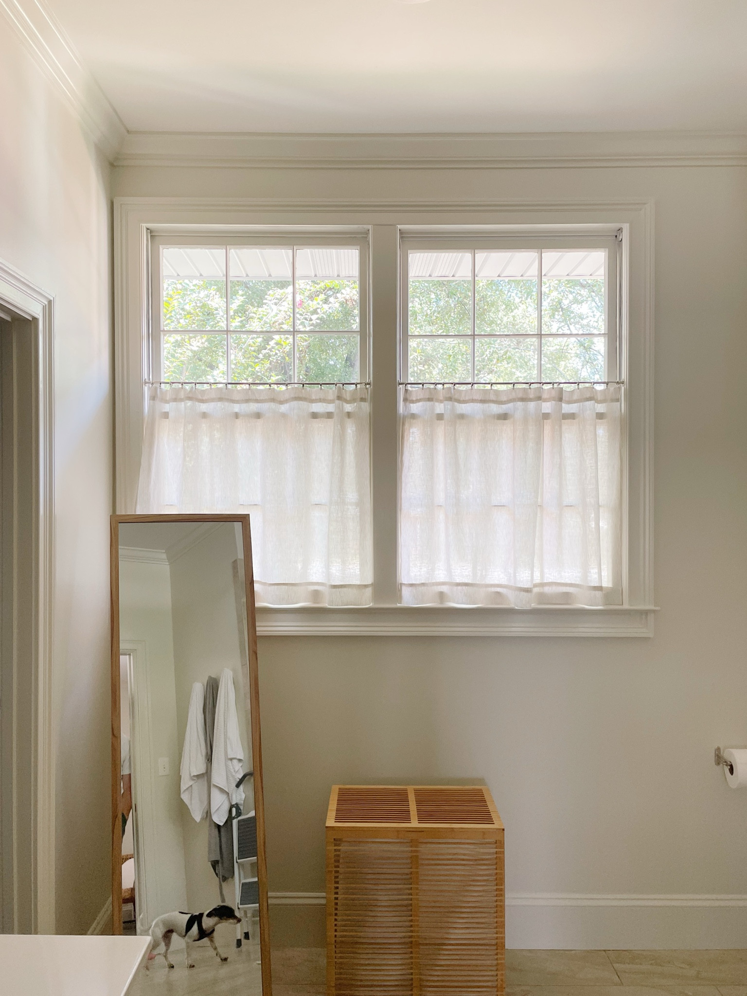 Cafe curtains were the perfect solution to giving us some privacy in our bathroom while still letting in a lot of natural light.

I used some beautiful remnant ticking stripe linen fabric and sewed the shades myself, but the cafe rods and clip are really what elevates this moment.

Tagging sources for you! I was a little nervous about the cafe curtain width at first but there is a 1/4”-1/2” wiggle room with how it attaches to the interior sides that ended up being perfect. Highly recommend!

I went with a polished nickel finish for both the rod and the ring clips.

#LTKHome #LTKFindsUnder100
