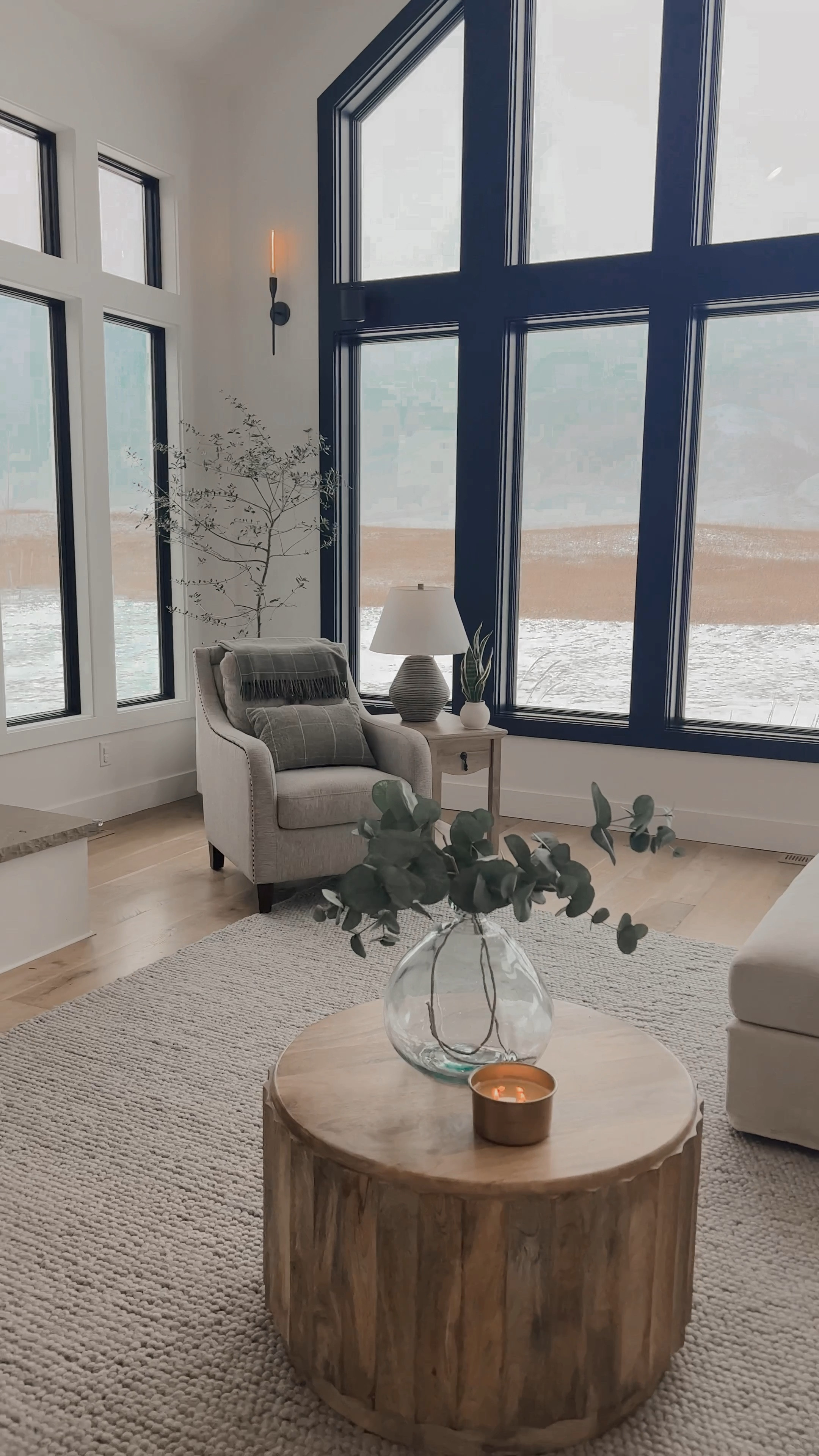 Living room preview with a lovely coffee table view.


Living room design 
Living room layout 
Double chaise couch 
Accent chairs 
Round coffee table 
Glass vase 
Yummy candle 
Console table 
Samsung frame TV 


#LTKHome