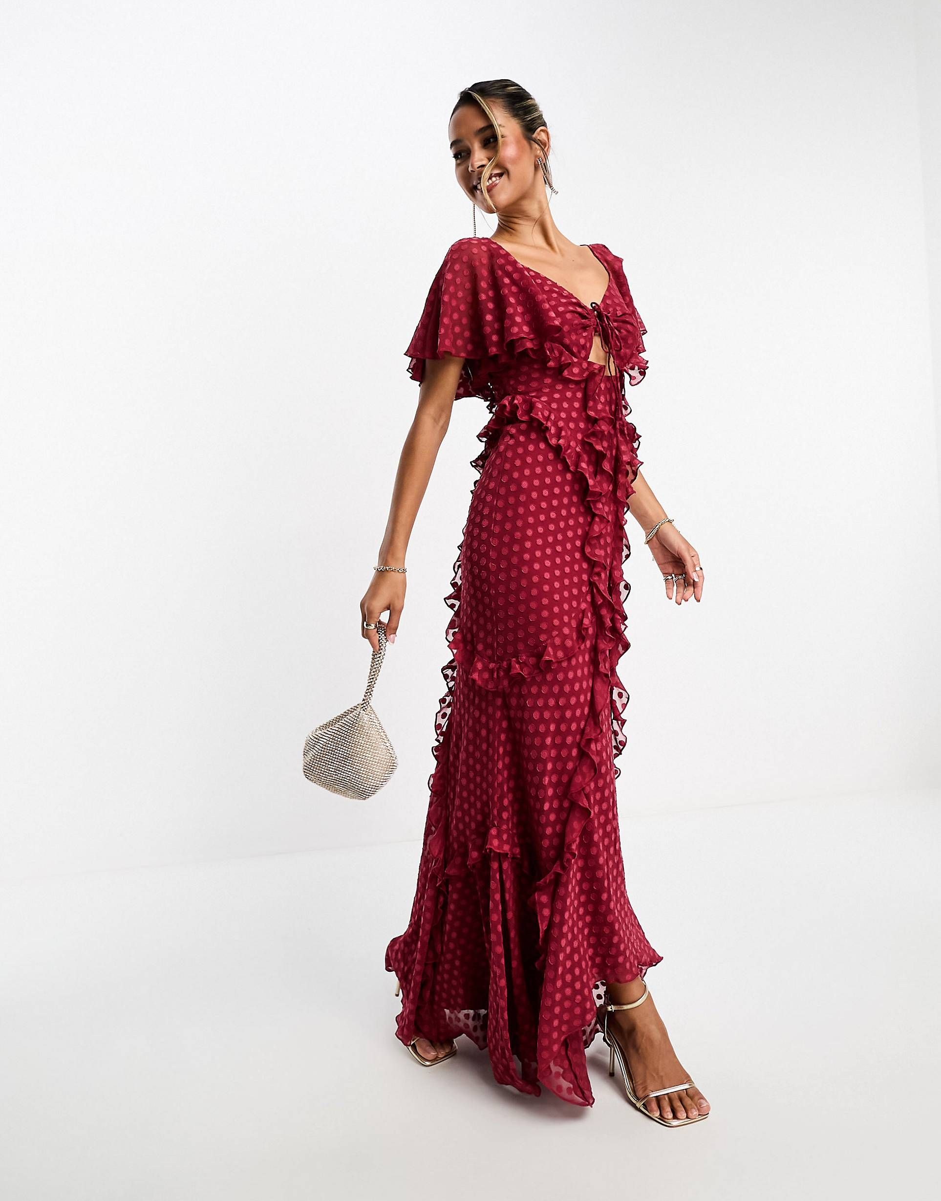 ASOS DESIGN flutter sleeve ruffle maxi dress with cut out detail in textured spot in dark red | ASOS (Global)