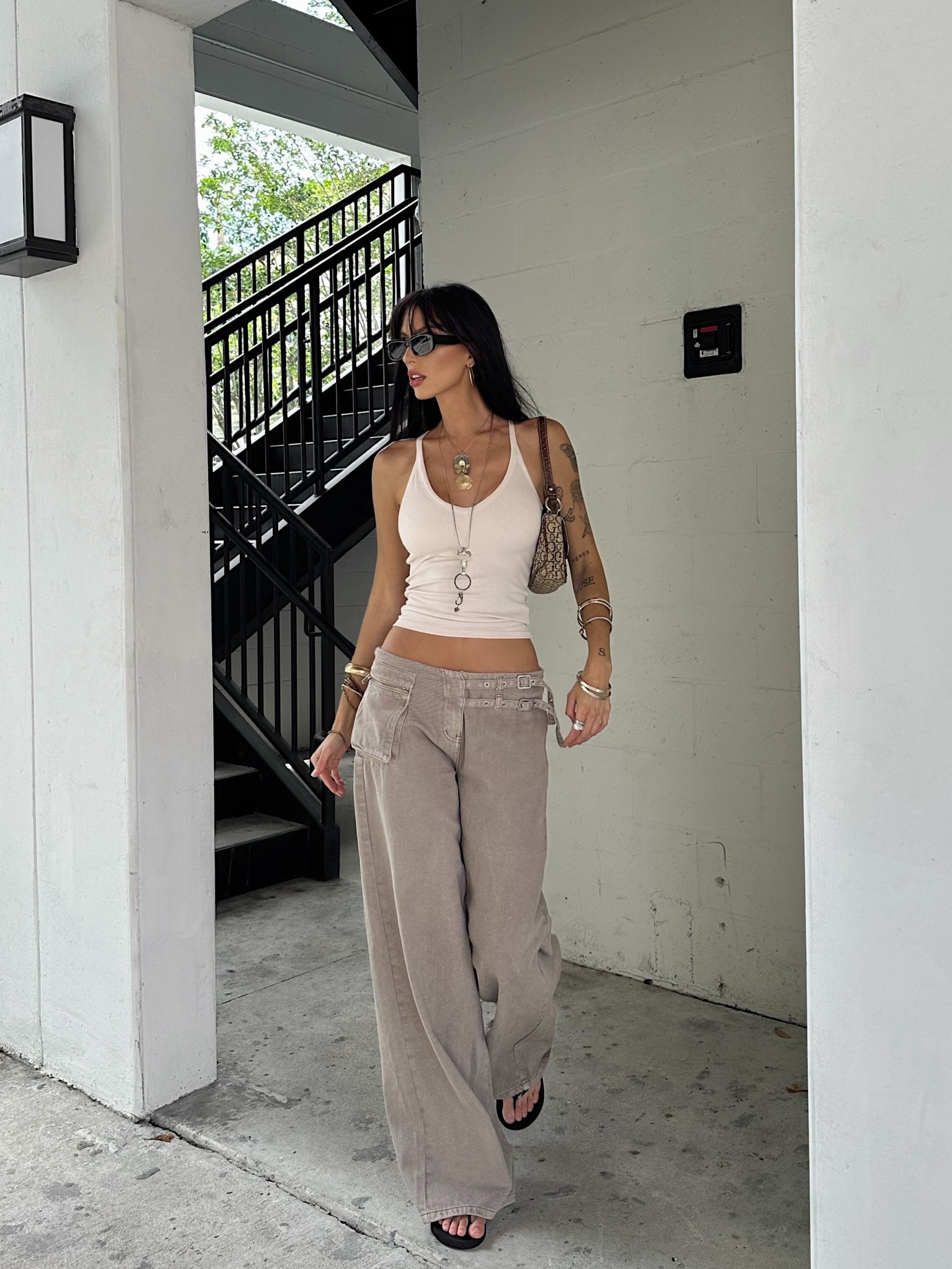 neutral outfit, casual street style, wide leg pants, white tank top, model off duty, minimalist summer outfit, trendy summer outfit, effortless style, princess polly

#LTKStyleTip #LTKFindsUnder100