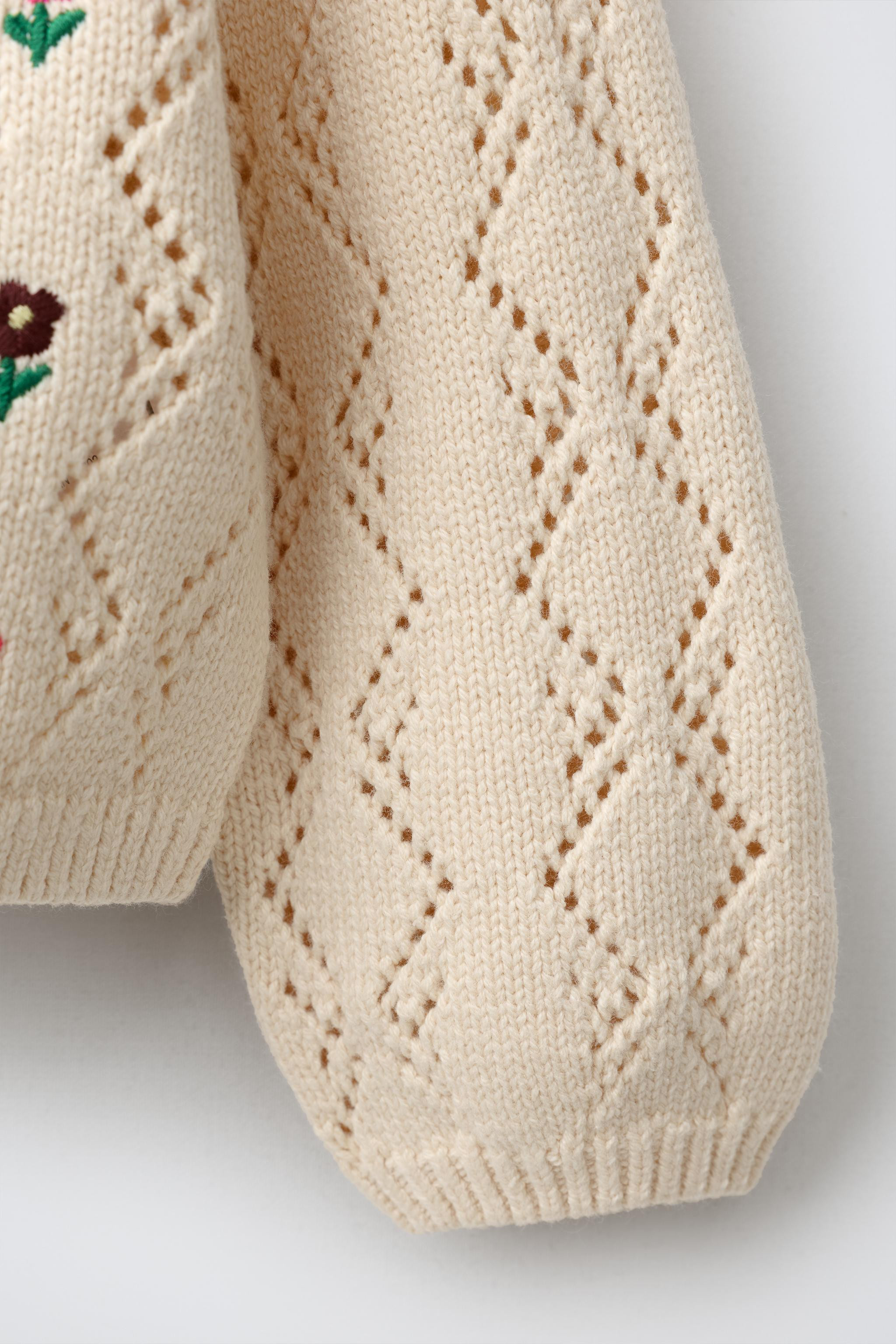Knit cardigan with a round neck and long sleeves. Front button closure. Features openwork detaili... | Zara US