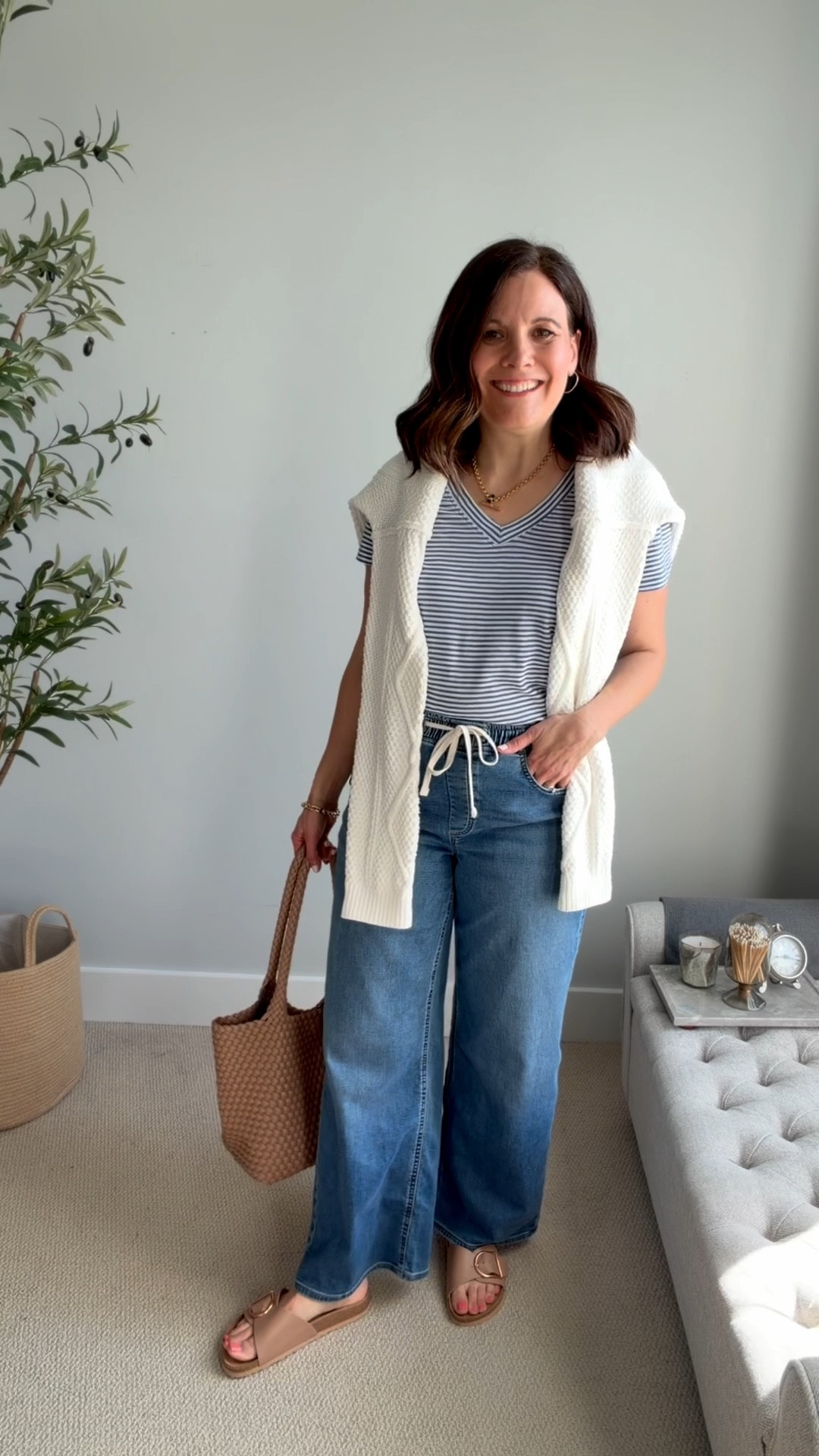 These drawstring jeans are from J. Crew Factory. They have an adjustable drawstring waist just like sweatpants (or joggers, as they’re currently called), and the material is super stretchy. They fit true to size, have a wide leg, and fit looser in the hips and thighs, with a 29-inch inseam, so they work with flats at 5'6". The waist rise hits at the waist and measures at 11.5 inches on a size 10. These are the jeans you reach for when your regular jeans feel like too much. Striped tee fits tts, I’m in a small. 

#LTKMidsize #LTKSaleAlert #LTKOver40