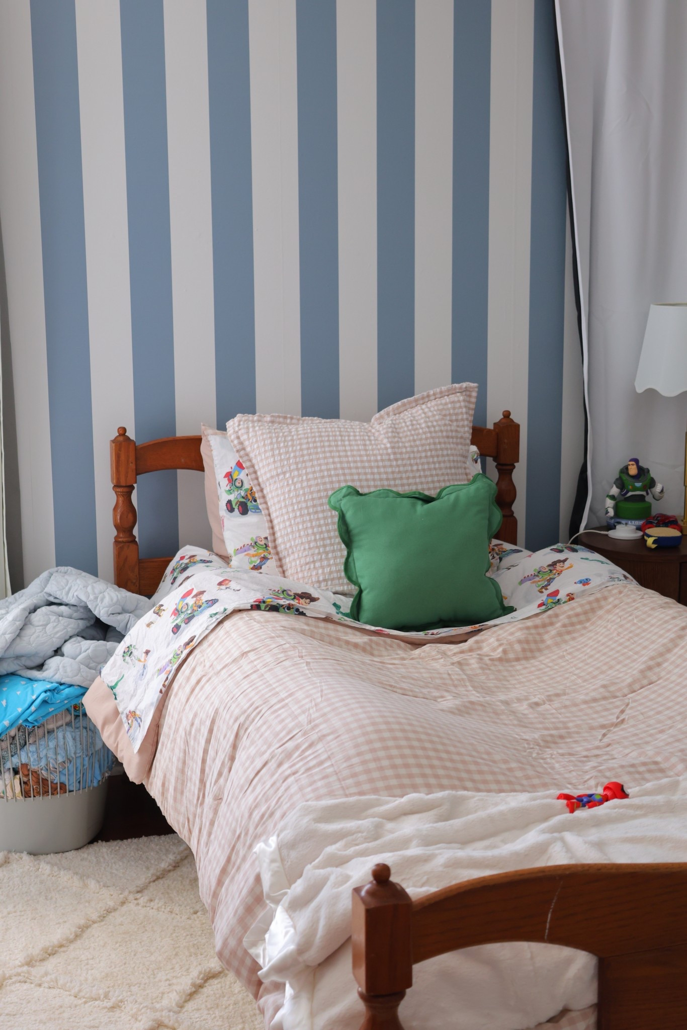 Little boys big boy room! Gingham bed cover with pottery barn kids sheets! Love vs. design striped wallpaper and little giraffe blanket to finish off the bed 🤍

#LTKKids #LTKFindsUnder100 #LTKFindsUnder50