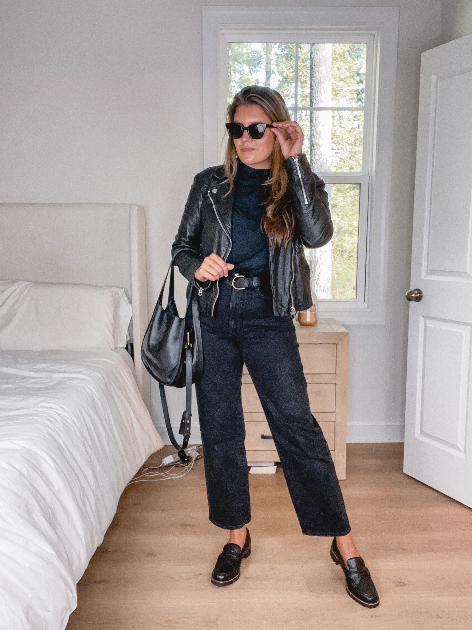 All black outfit.
Fall outfit idea: black wide leg jeans, black oversized tee, black leather jacket, black loafers. 

#LTKstyletip #LTKunder100