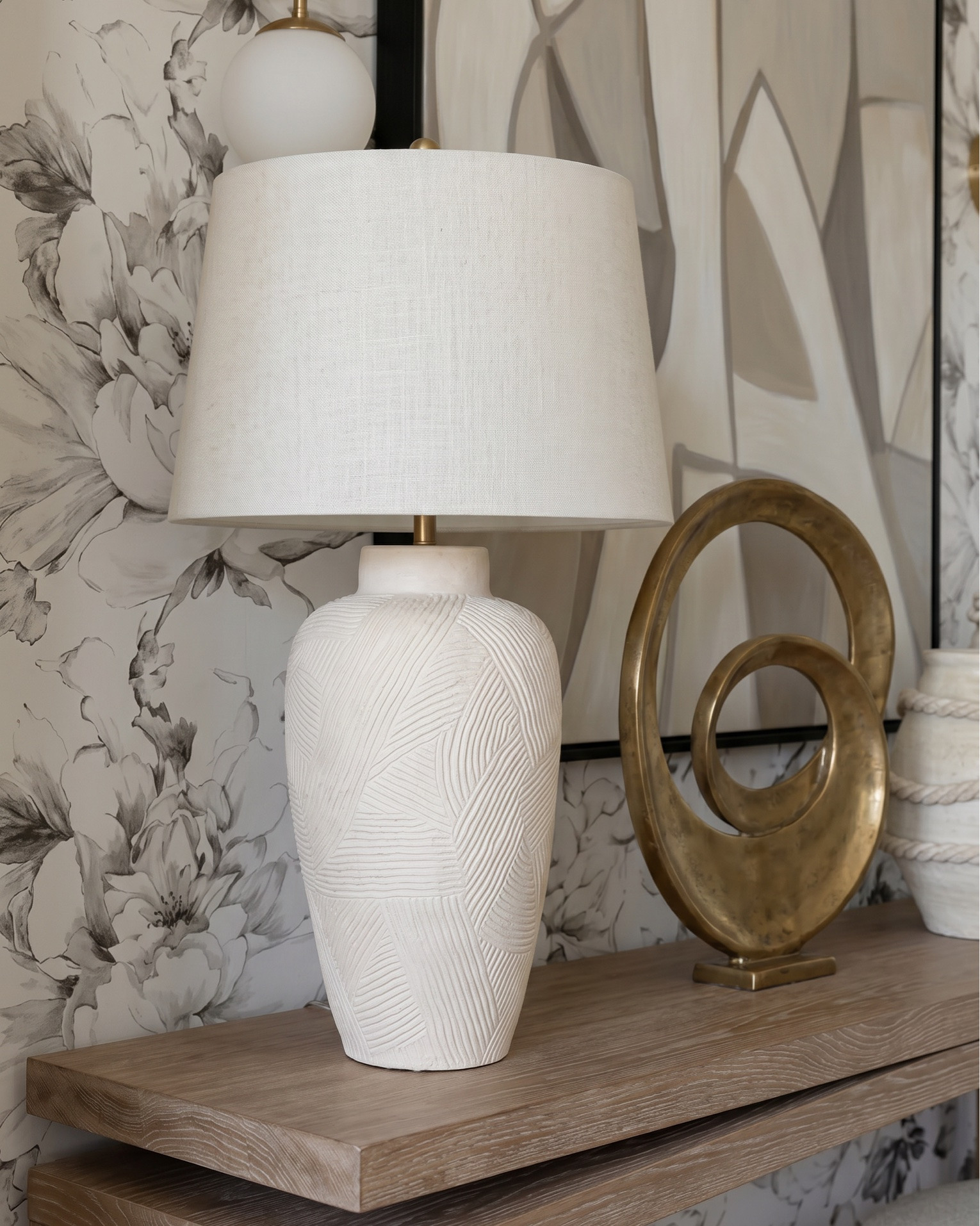 Shop the look:
• Fluted cream built-in cabinetry
• Brass cabinet hardware (pulls + knobs)
• Glass-front upper cabinet doors (reeded / ribbed glass)
• Brass dual globe wall sconces (white milk glass)
• Built-in wine fridge (glass door, brass trim)
• Espresso machine / built-in coffee station
• Decorative ceramic face sculpture
• Neutral ceramic bowls
• White ceramic pitcher
• Amber glass bottles
• Framed vintage artwork
• Decorative wood tray
• Brass bowl / catchall
• Sculptural woven vase
• Neutral decorative books
• Large woven or textured runner rug (taupe / beige)
• Light oak ceiling beams
• Light wood console table (minimal modern design)
• Upholstered round stools / vanity stools
• Neutral floral wallpaper (large-scale botanical print)
• Oversized abstract wall art (black frame)
• Brass double globe sconces
• Ceramic table lamp (neutral textured base)
• Gold sculptural ring decor
• Large rope detail ceramic vases
• Vintage-inspired neutral hallway runner
• Decorative wood bowls
• Ceramic decor accents
• Cream boucle accent chair
• Arched black-framed window
• Light gray upholstered wingback bed
• White bedding set (duvet + sheets)
• Chunky knit throw blanket (cream)
• Neutral accent pillows (textured + patterned)
• Upholstered bedroom bench (cream with brass legs)
• Light wood nightstands (3-drawer)
• Pleated table lamp (neutral ceramic base)
• Large glass vase with greenery / dried florals
• Ornate gold full-length mirrors
• Brass double globe wall sconces
• Large abstract artwork above bed
• White globe pendant light
• Vintage-inspired area rug (gray / beige)
• Light wood ceiling beams
• Soft linen curtains (cream)
• Herringbone hardwood flooring
• Small ceramic vase with dried florals
• Decorative bedside styling
• Neutral ceramic lamp
• Gold framed mirrors
• Minimal layered pillows
• Luxury hotel-style white duvet

#LTKsale #LTKhome
