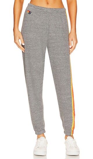 5 Stripe Sweatpant in Heather Grey & Yellow Purple | Revolve Clothing (Global)