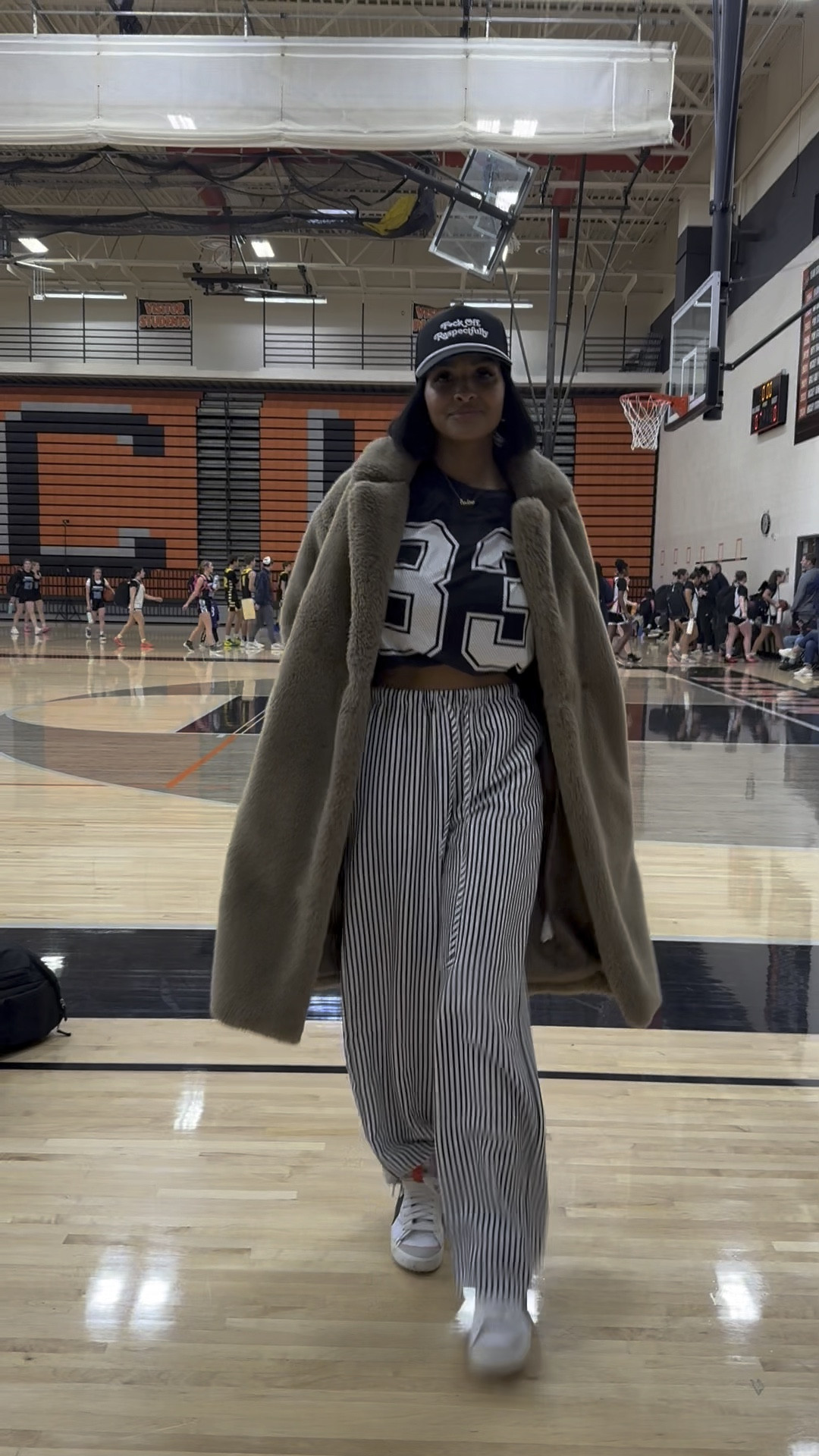 Sports Mom Game Day OOTD 🏀 Faux fur trench over a jersey with a printed pant 🤌🏽 

#LTKFindsUnder50 #LTKWatchNow #LTKStyleTip