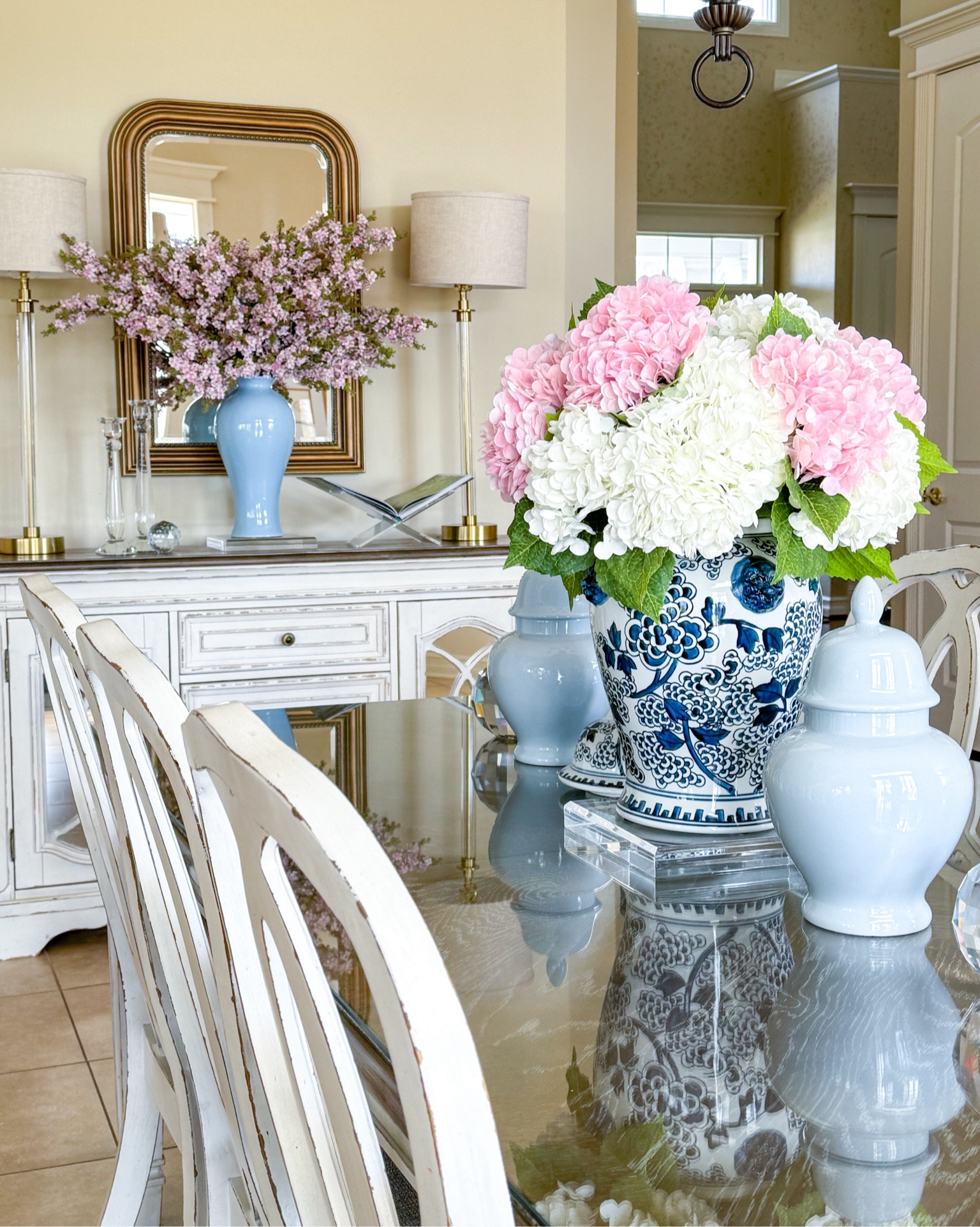 Shop my spring kitchen table and buffet decor!

Spring decor, centerpiece ideas, faux flowers, faux hydrangeas, real touch hydrangeas, pink hydrangeas, white hydrangeas, blue vase, ginger jar, chinoiserie, buffet lamps, Ballard designs, Louis mirror, acrylic risers, acrylic book stand, crystal candleholders, crystal orb

#LTKhome #LTKSeasonal #LTKfindsunder100