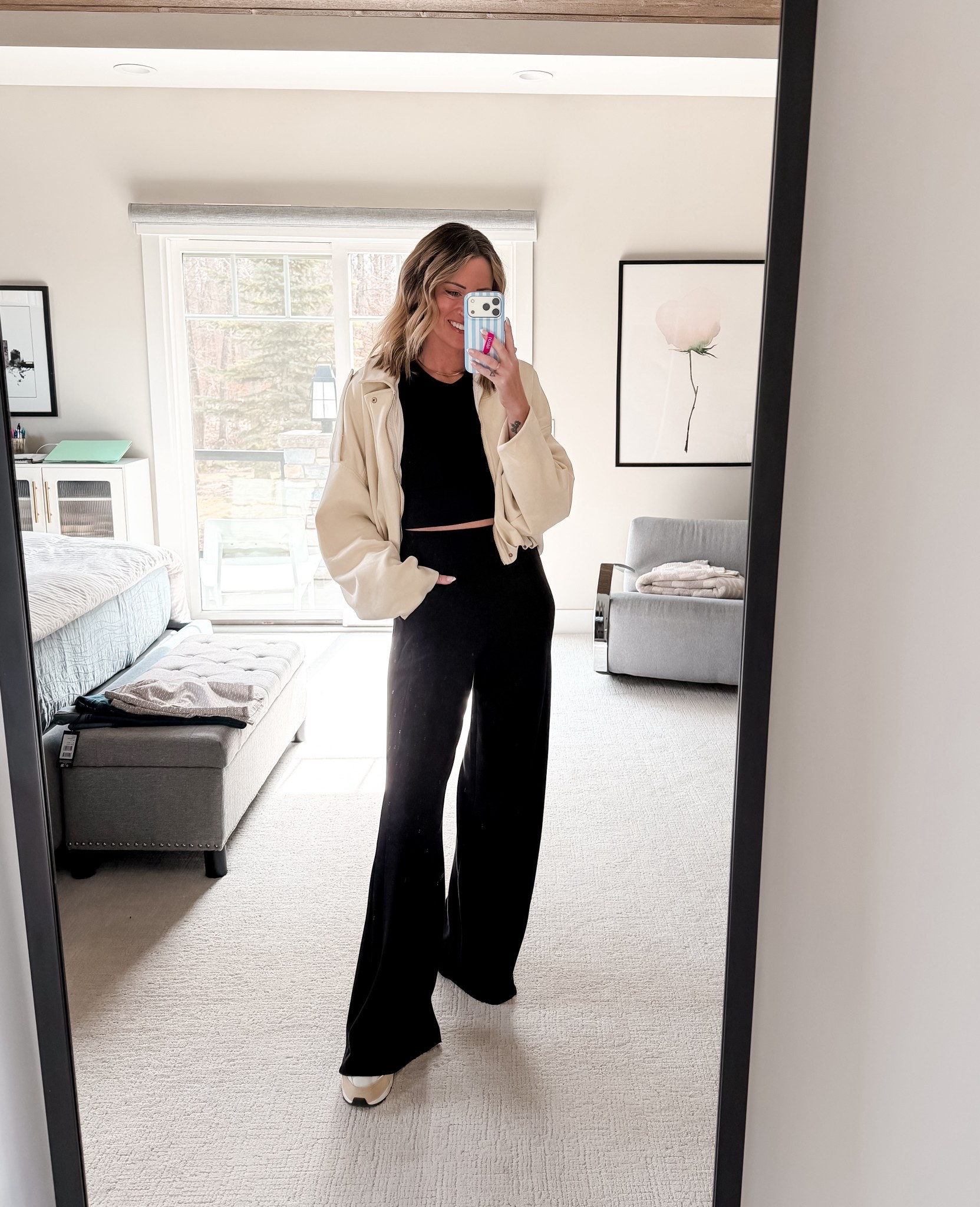 Spring outfit ideas for sports mom
White bomber jacket and black wide leg Spanx pants 