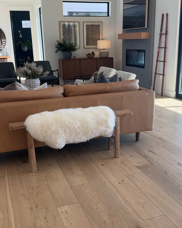 Winter living room styling featuring vintage wood bench, Amazon leather couch, &…
