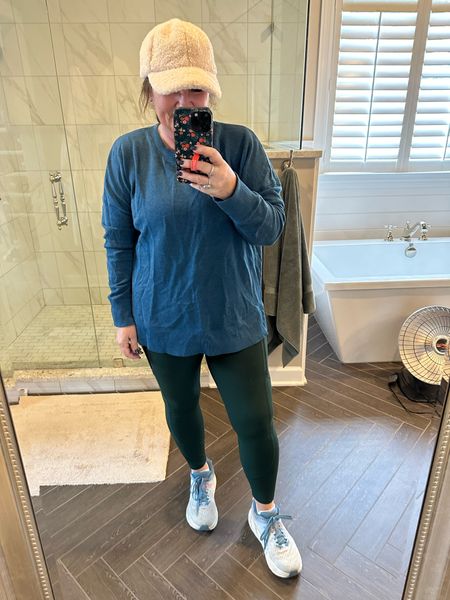 Post run selfie. Changed out of my running top in to this $10 Walmart sweatshirt. Side slits. The perfect tunic for casual wear. Post workout. Size up! You want it roomy. New spring colors available. 

Rainier running tights. The only tights I wear in the cold weather. 

And hokas are a must have. 

This silky cap is do warm. I’ve grown to love it. 😉

#LTKfitness #LTKmidsize #LTKover40