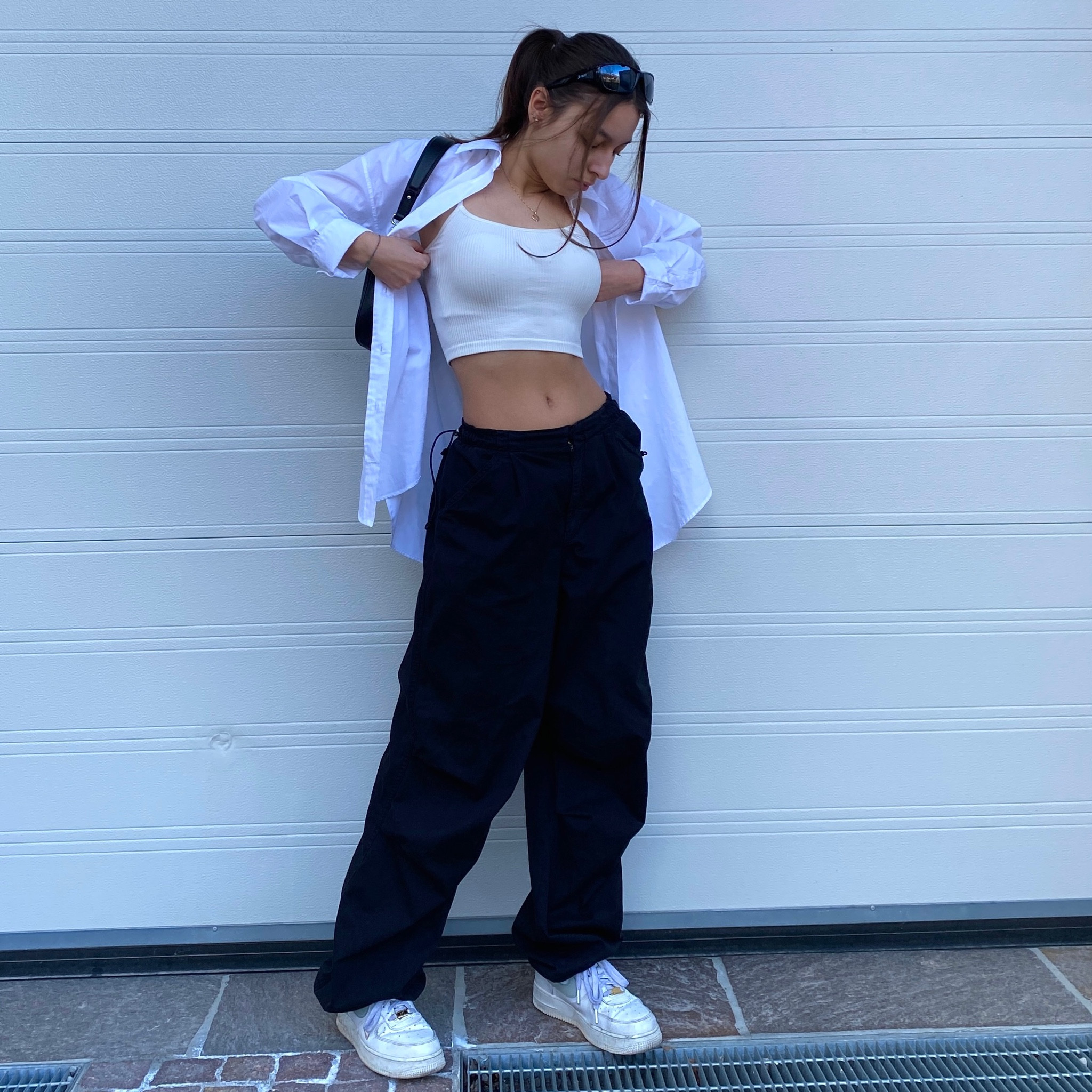Parachute Pants, Black Pants, Bershka, Streetstyle, Outfit, black trousers, black jeans, parachute pants outfit, white top, white crop top, white blouse, white shirt, white air force 1, nike air force, black handbag

#LTKstyletip #LTKeurope