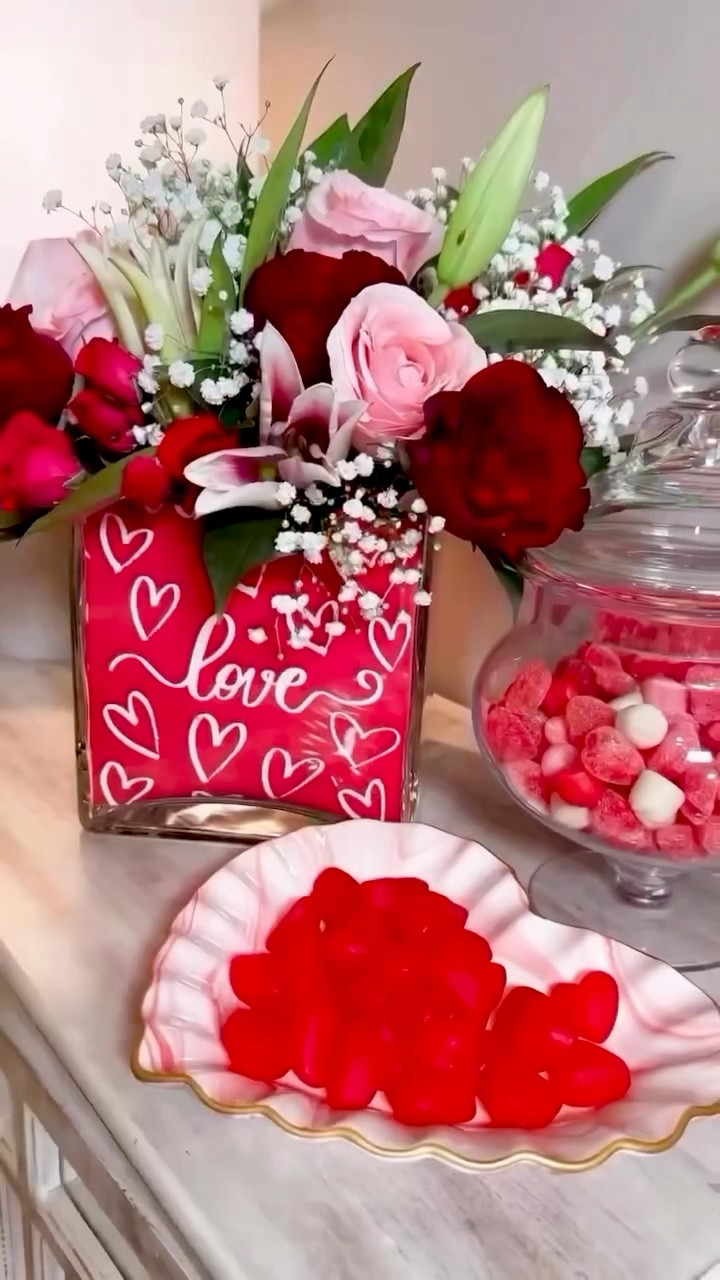 Valentine’s Napkin Floral Arrangement 💐Create a designer-style bouquet using printed paper napkins and store-bought flowers—no need for a florist. This easy technique delivers a festive, polished arrangement for Valentine’s Day, Galentine’s gatherings, February birthdays, or winter entertaining.

It doubles as a beautiful hostess gift or centerpiece, with a simple tape-grid method that keeps flowers upright and full—no slouchy stems.

#LTKValentine #LTKSeasonal #LTKHome