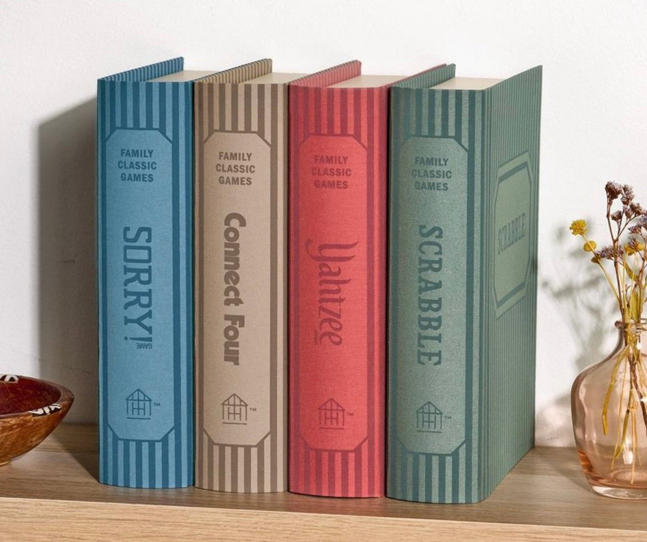 Looks like books but actually it’s classic board games right inside the book box. 
SORRY, Yahtzee, Connect Four, Scrabble

#LTKHoliday #LTKFamily #LTKGiftGuide