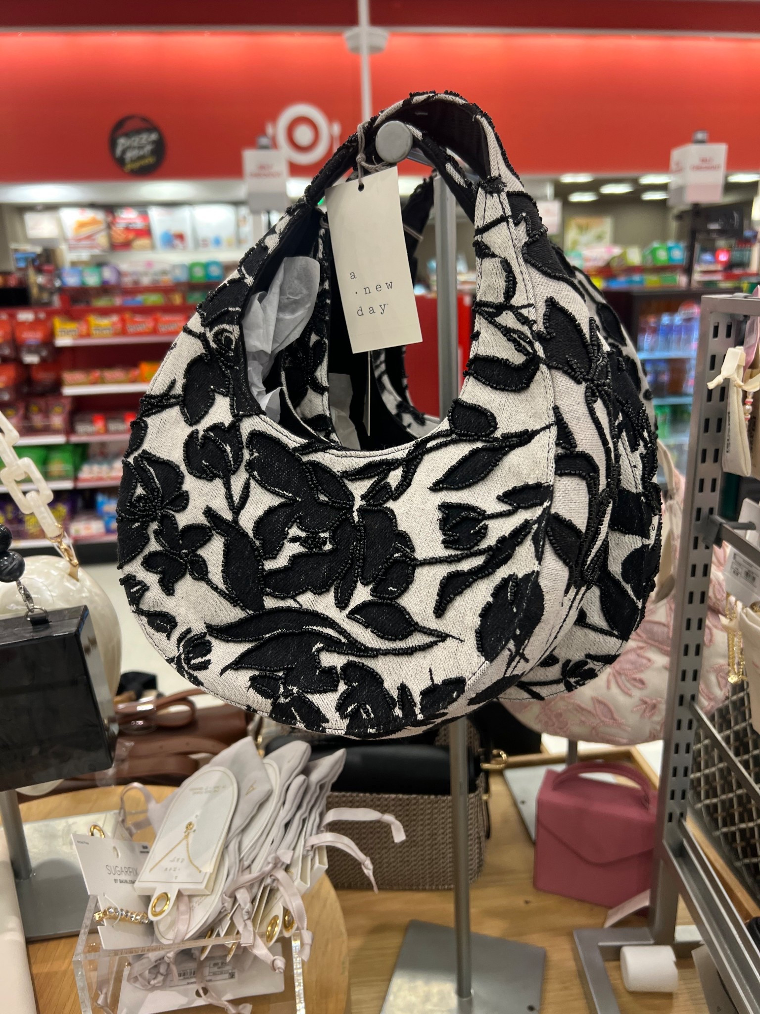 Classy meets sassy with this super cute purse! Elevate your look with black embroidery details that add a touch of elegance. Perfect for spring and on sale now! 💁🏾‍♀️👜✨

#LTKStyleTip #LTKSaleAlert #LTKFindsUnder50