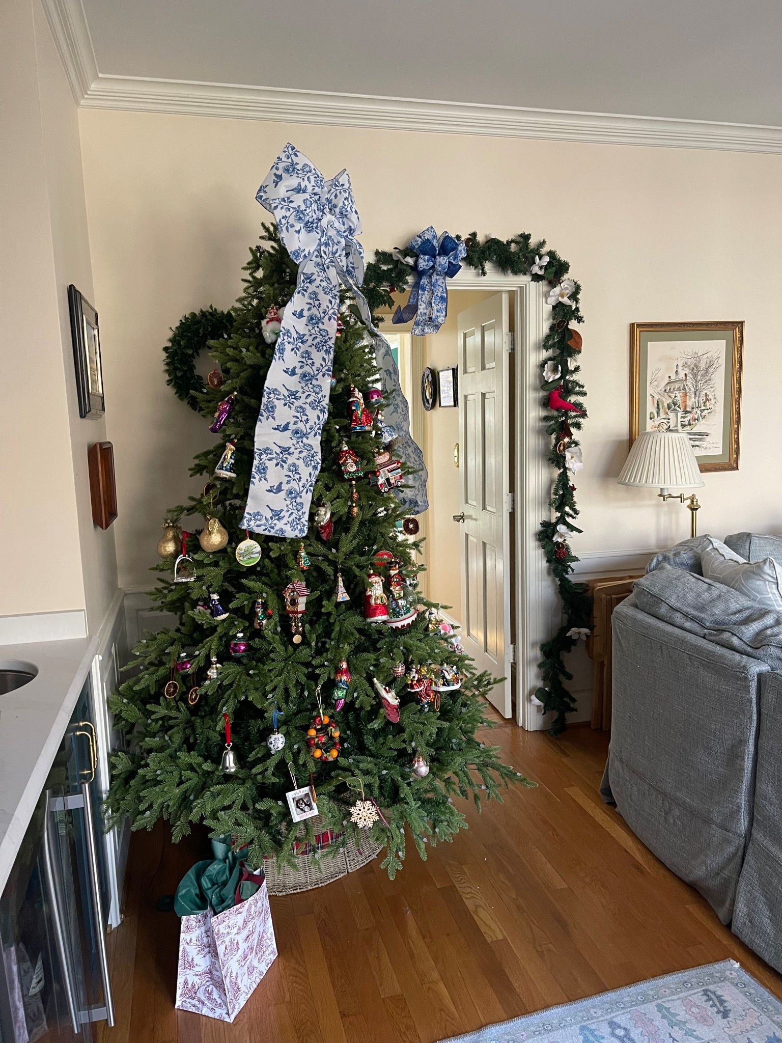 Blue & White Chinoiserie Christmas Tree 💙🎄 | Classic Ornaments & Magnolia Garland

⸻
Our blue-and-white chinoiserie Christmas tree is officially up and it makes the whole room feel magical 💙🎄✨ I used an oversized chinoiserie bow topper, loads of Christopher Radko ornaments, and a mix of blue & white porcelain pieces to tie everything together. The magnolia leaf garland with white florals frames the doorway beautifully and adds that timeless Southern touch. Linking everything I used (or as close as possible!) so you can recreate this classic holiday look in your home.

: blue and white Christmas decor, chinoiserie Christmas ornaments, classic Christmas tree ideas, timeless holiday decor, magnolia garland, Christopher Radko ornaments, Amazon Christmas finds, Southern Christmas style, holiday doorway garland.

#LTKFindsUnder50 #LTKHoliday #LTKHome
