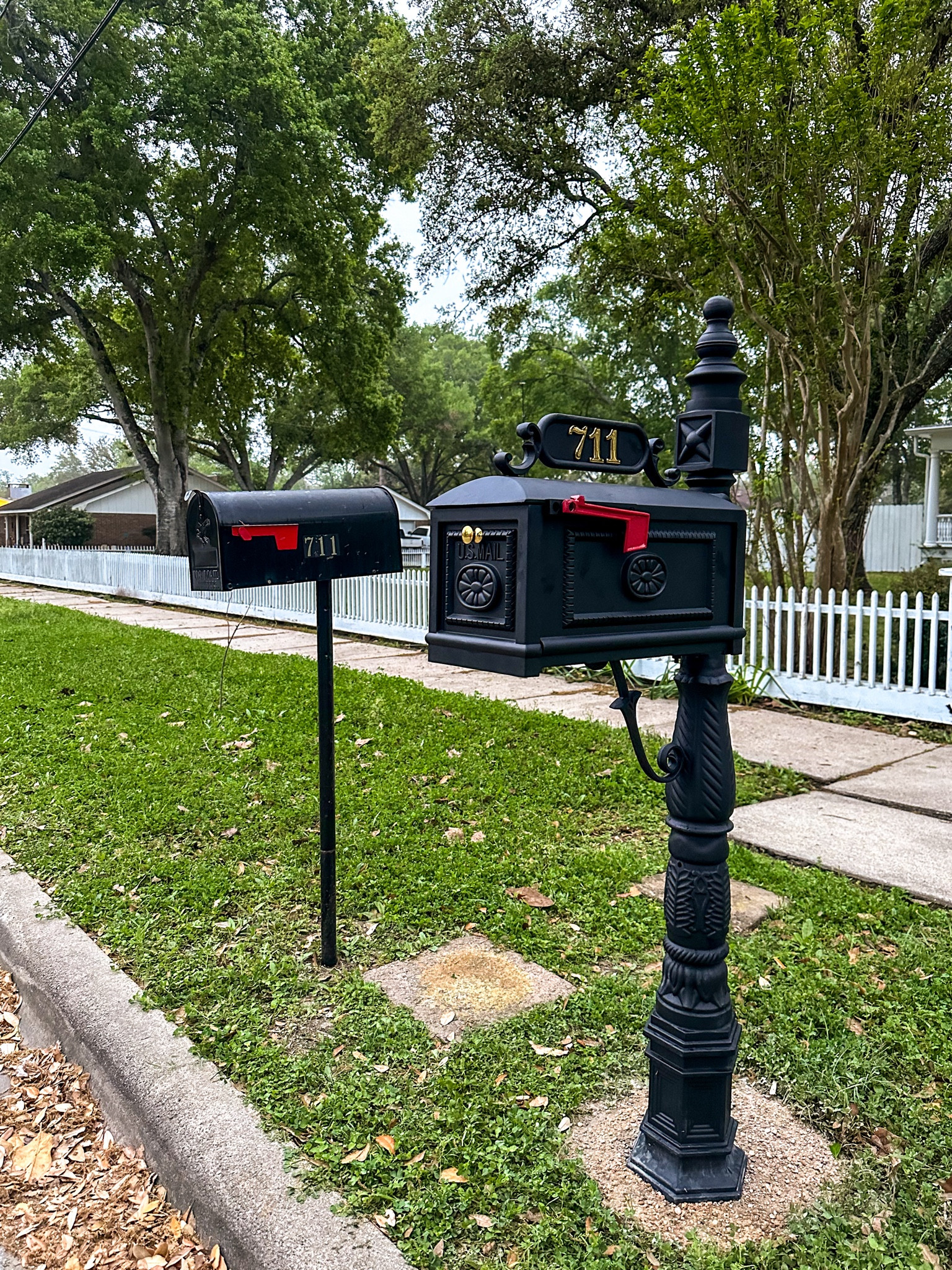 A side-by-side comparison of the old mailbox and the new one. The new one compliments our 1912 home and extends the historic charm out to the curbside. It’s heavy duty with a box capacity that is much bigger than the old one. 

#LTKhome
