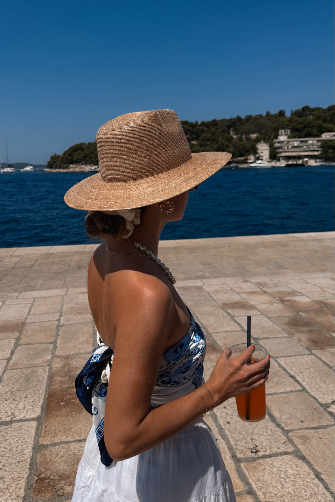 love a scarf top!🌊🤍🇬🇷🍊

Euro summer outfit, coastal vacation style, scarf top outfit, silk scarf top, white skirt outfit, linen skirt, beach club outfit, seaside lunch look, Mediterranean style, straw hat outfit, woven sun hat, summer accessories, gold jewelry stack, pearl necklace outfit, effortless chic style, vacation outfit idea, resort wear look, Europe outfits, classy summer outfit, coastal chic aesthetic, breezy summer look, travel outfit inspo, elevated casual outfit, warm weather styl

#LTKdayinmylife #LTKgrwm #LTKootd