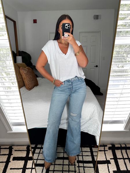 Express Supersoft Linen-Blend Skimming V-Neck Tee wearing size medium $34. Express Mid Rise Light Wash Ripped 70s Flare jeans wearing size 6 $88. 


