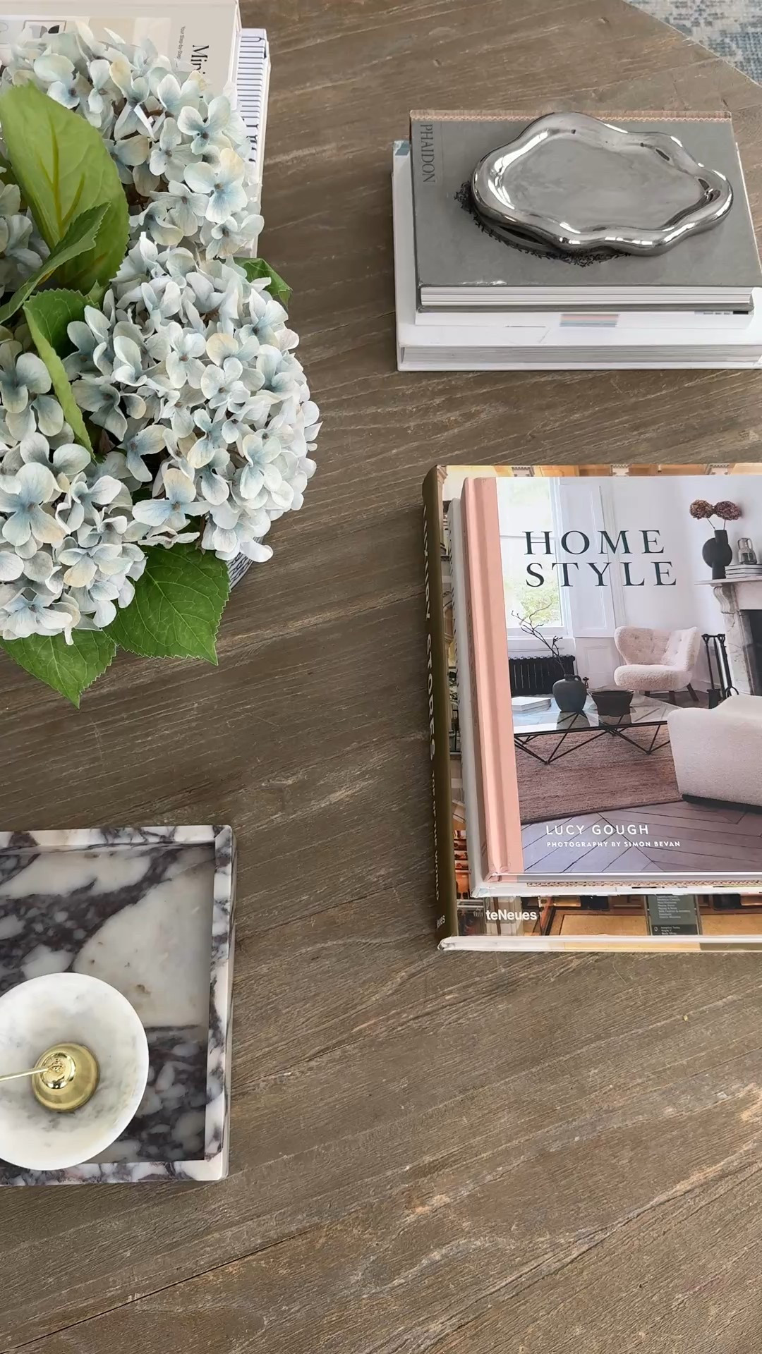 Essential coffeee table accessories! I love to collect beautiful coffee table books (I use them everywhere!). This marble tray is gorgeous and from Amazon! A hurricane for your favorite candle so you don’t have to worry about the flame being too close to kids or pets. And I love these faux hydrangea in the blue and white vase!!  

#LTKHome #LTKSeasonal #LTKSaleAlert